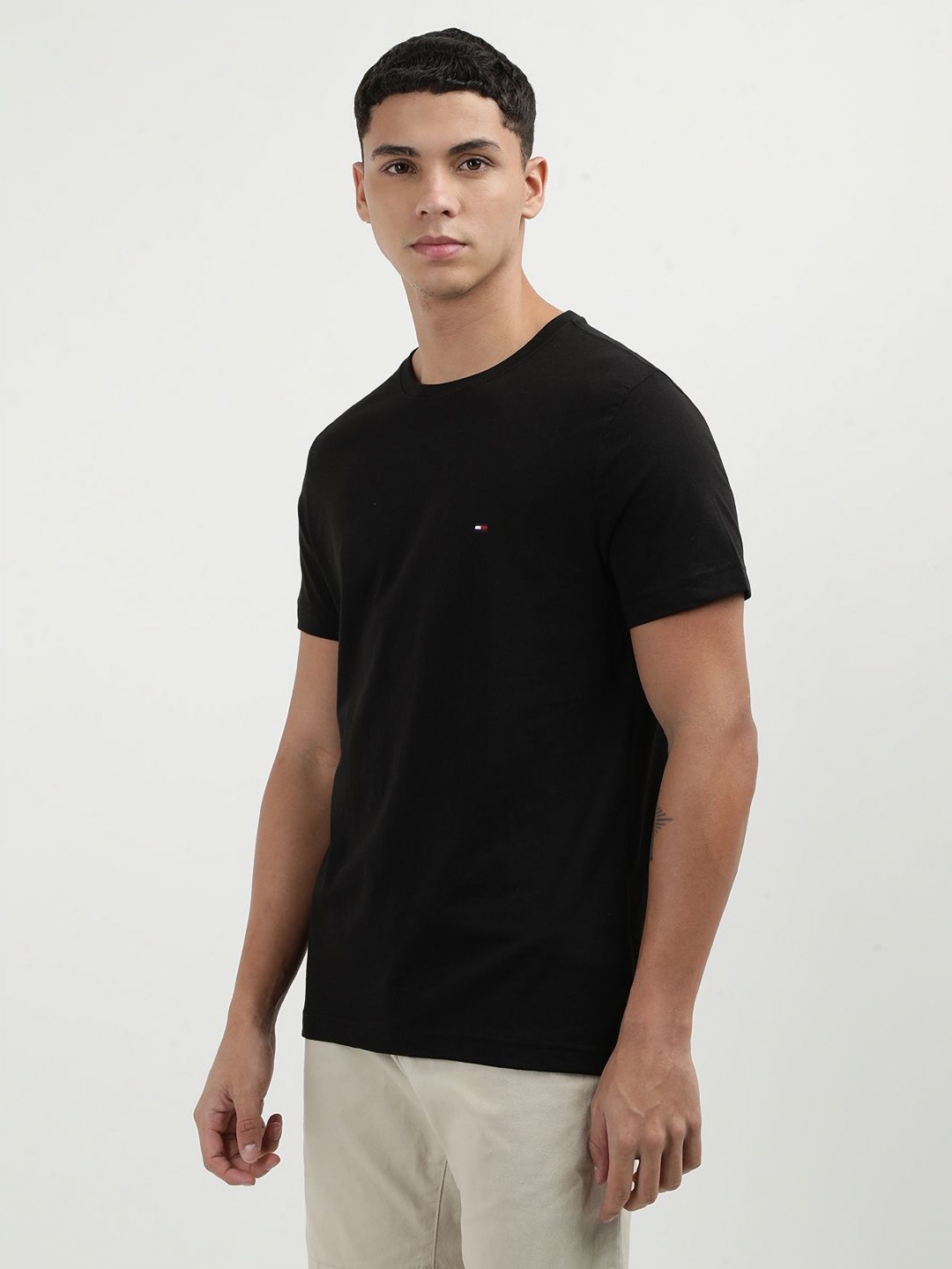 

Tommy Hilfiger Men Solid Round Neck Cotton Slim Fit T-Shirt, Black