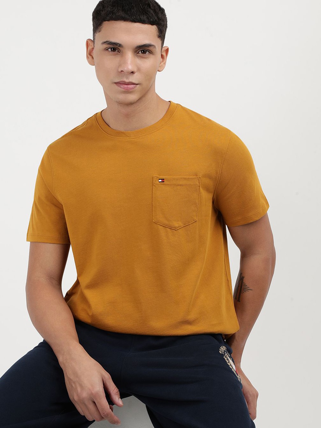 

Tommy Hilfiger Men Solid Round Neck Cotton T-Shirt, Yellow