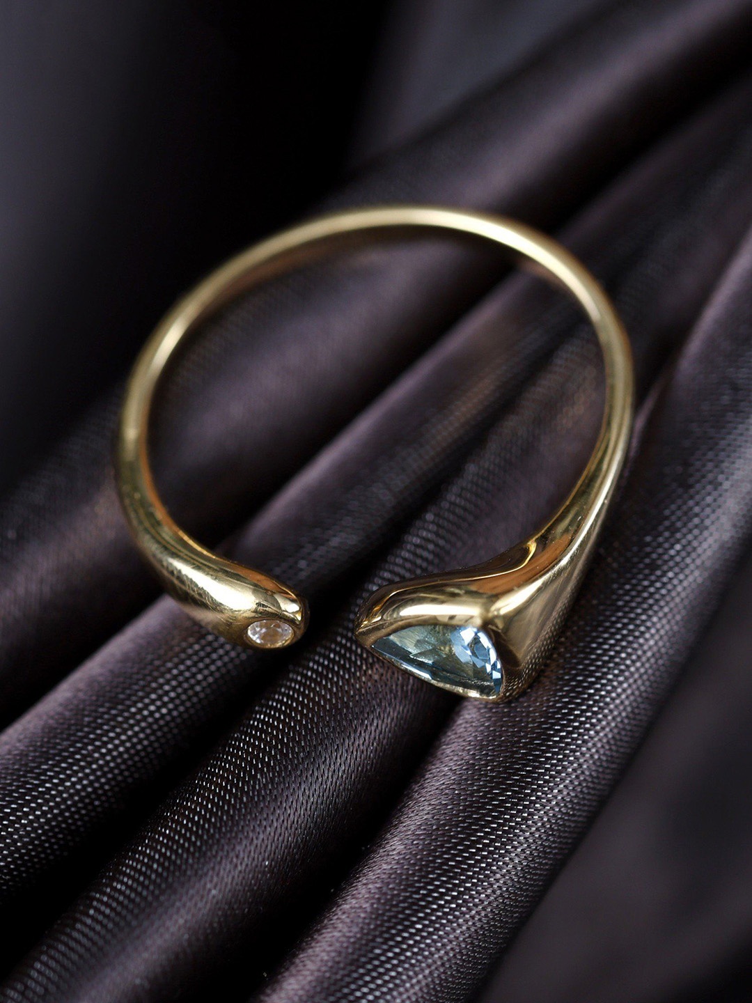 

Exotic India Faceted Blue Topaz Gemstone Sterling Silver Stylish Ring, Gold
