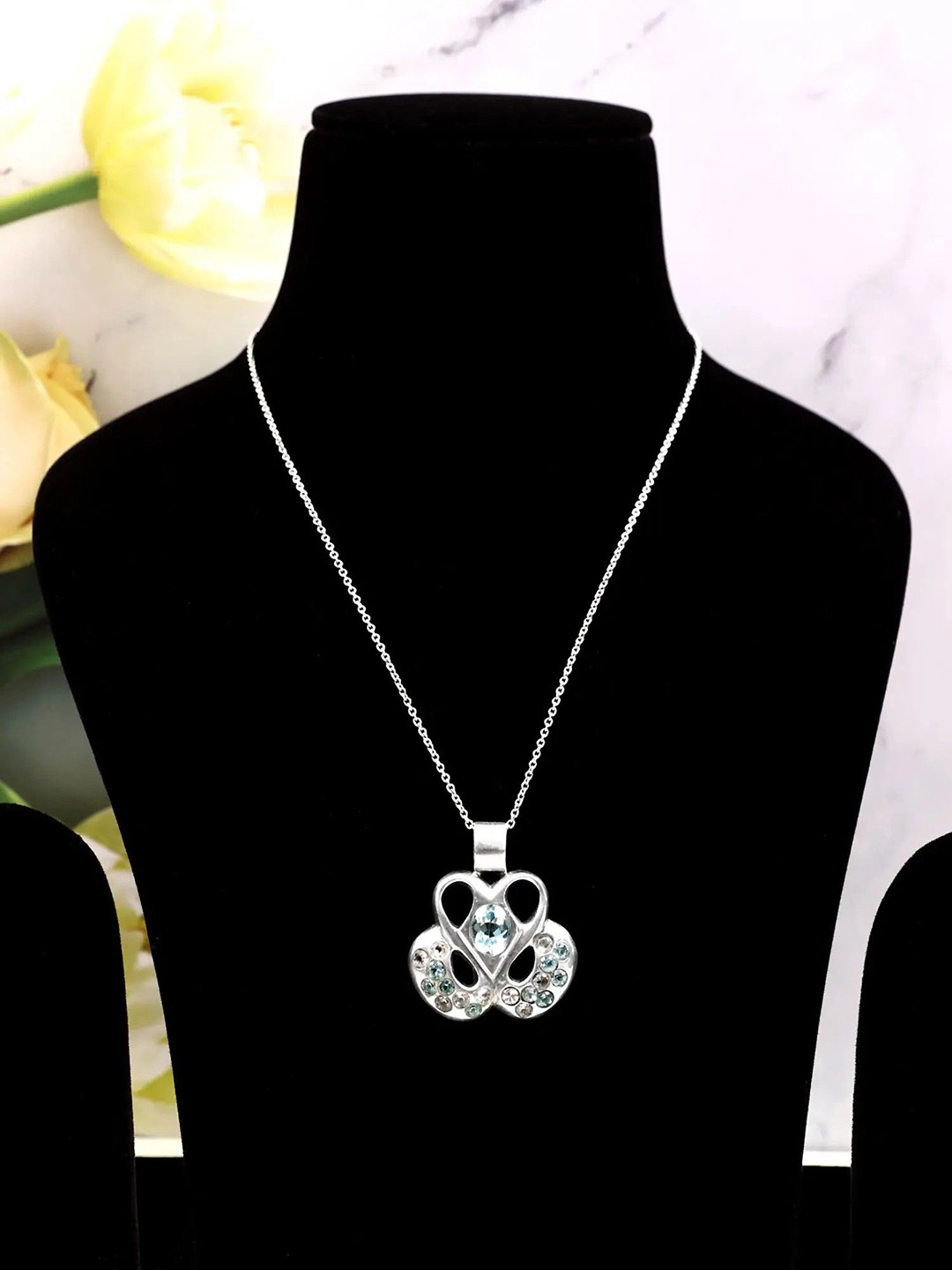 

Exotic India Blue Topaz and Crystal Stone Stylish Sterling Silver Pendant