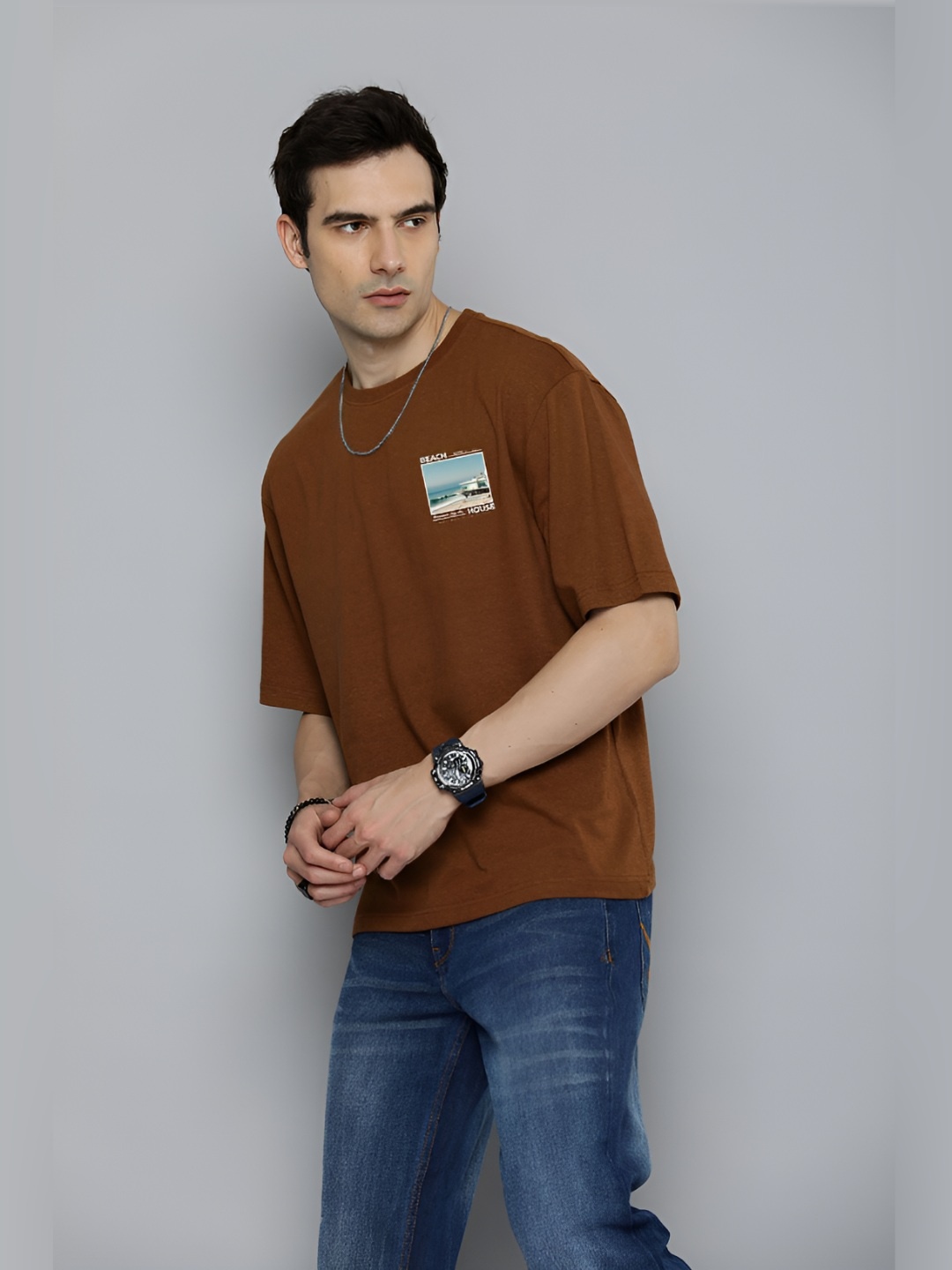 

The Roadster Lifestyle Co.Men Graphic Printed Round Neck Cotton Oversized T-Shirt, Brown