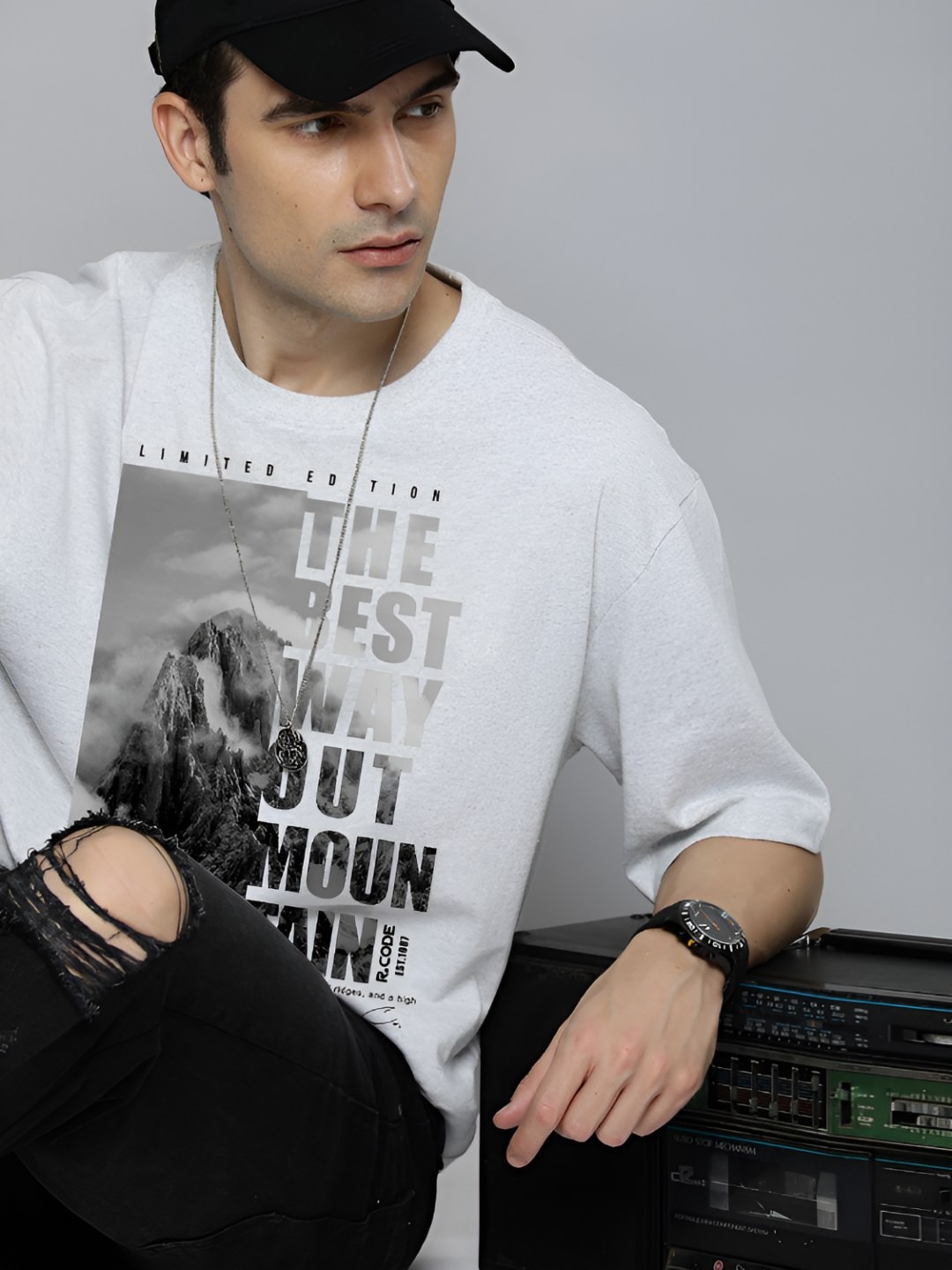 

The Roadster Lifestyle Co.Men Graphic Printed Round Neck Cotton Oversized T-Shirt, White