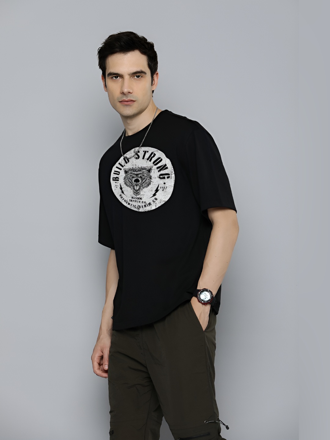 

The Roadster Lifestyle Co.Men Graphic Printed Round Neck Cotton Oversized T-Shirt, Black