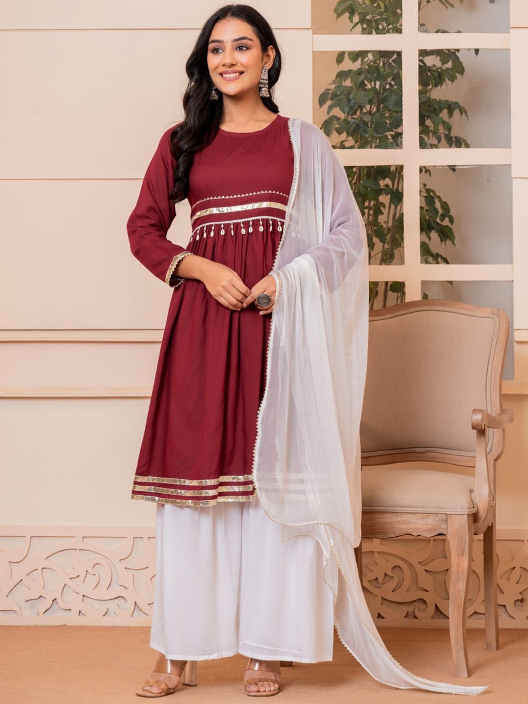 

SHOOLIN Women Regular Beads and Stones Kurta with Sharara & With Dupatta, Burgundy