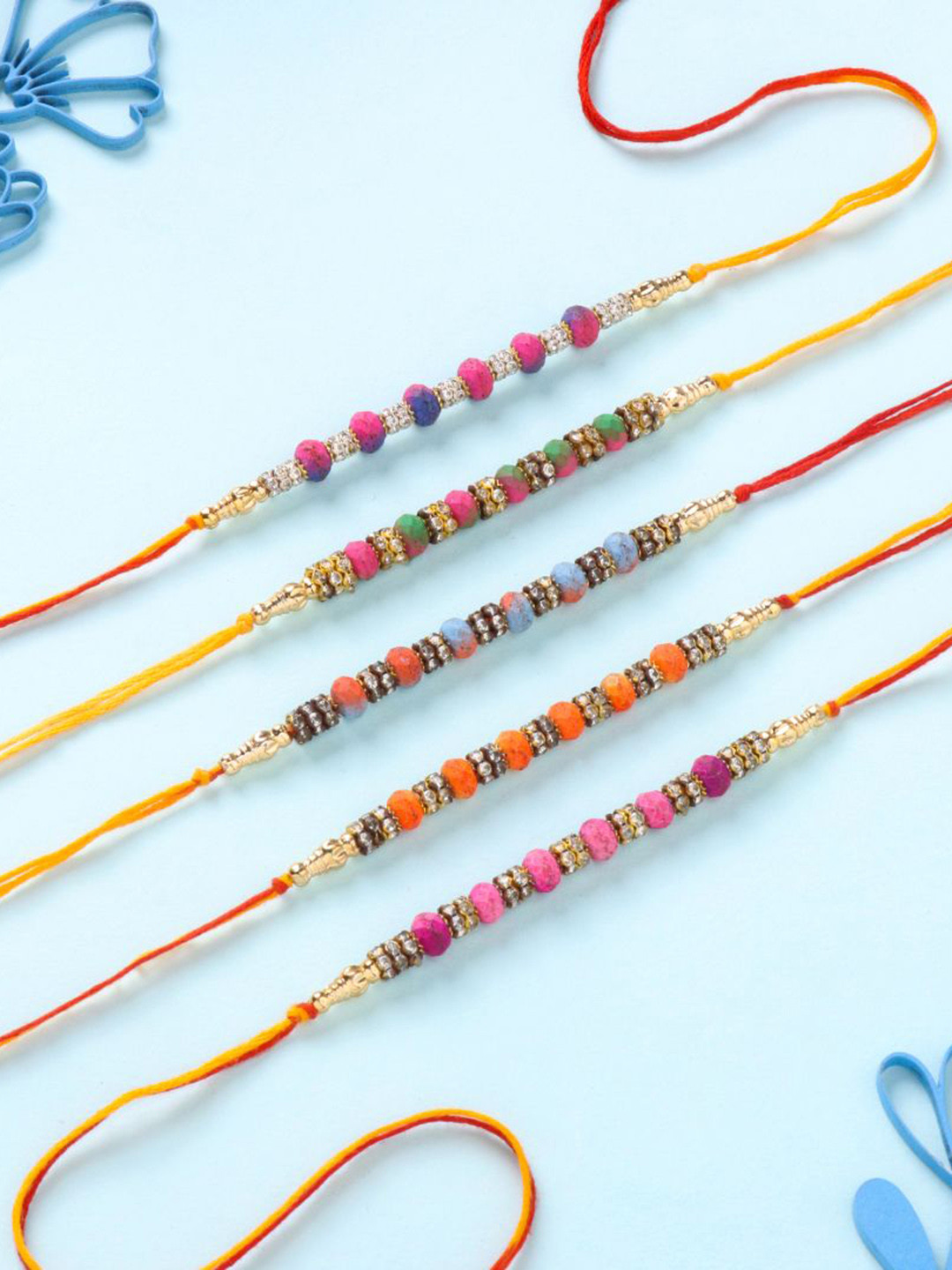 

Floweraura Set Of 5 Stone Studded & Beaded Thread Rakhis With Roli Chawal, Pink
