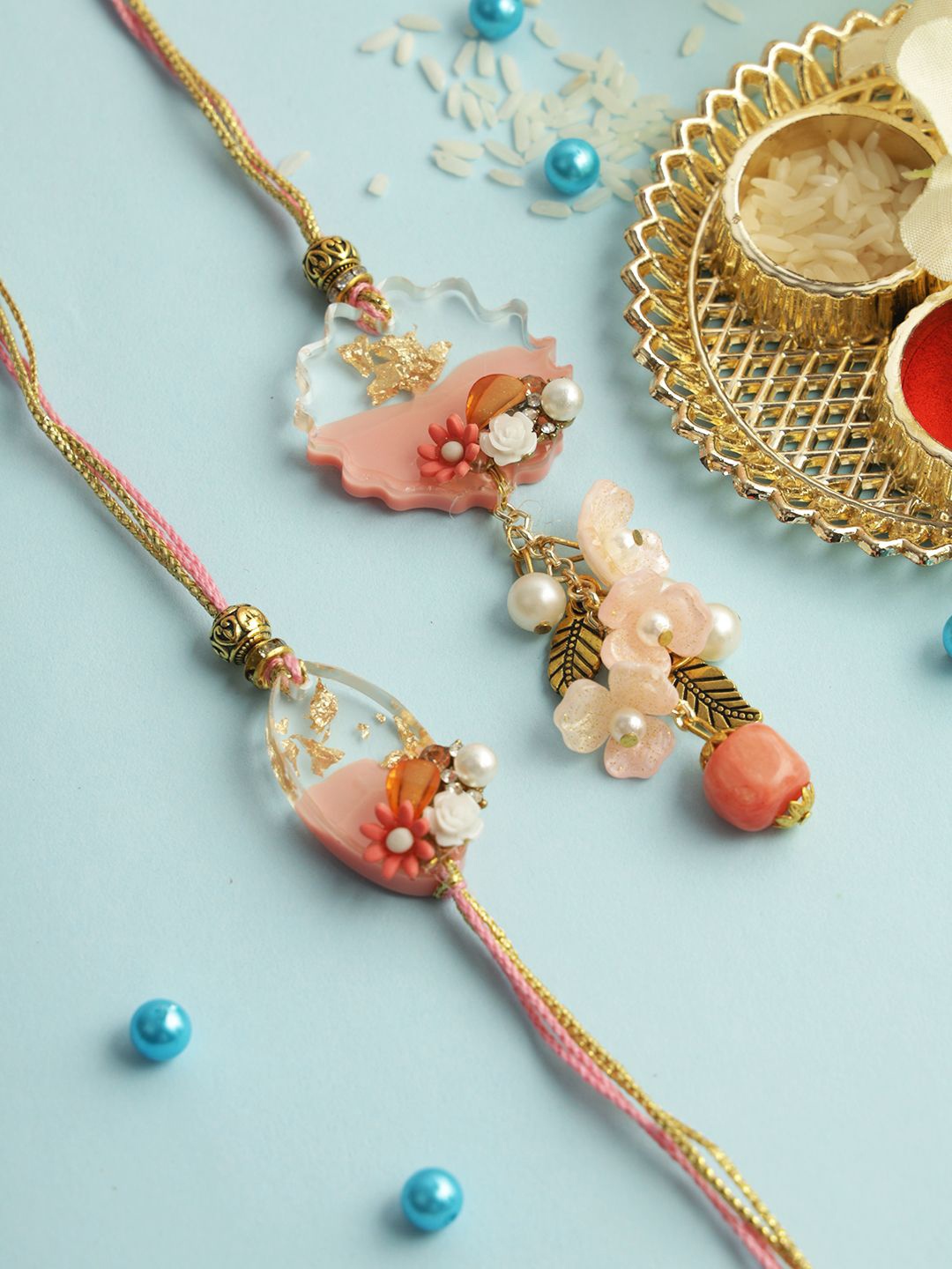 

Sangria Gold-Toned Floral Resin Work Bhaiya Bhabhi Rakhi With Roli Chawal & Greetings Card