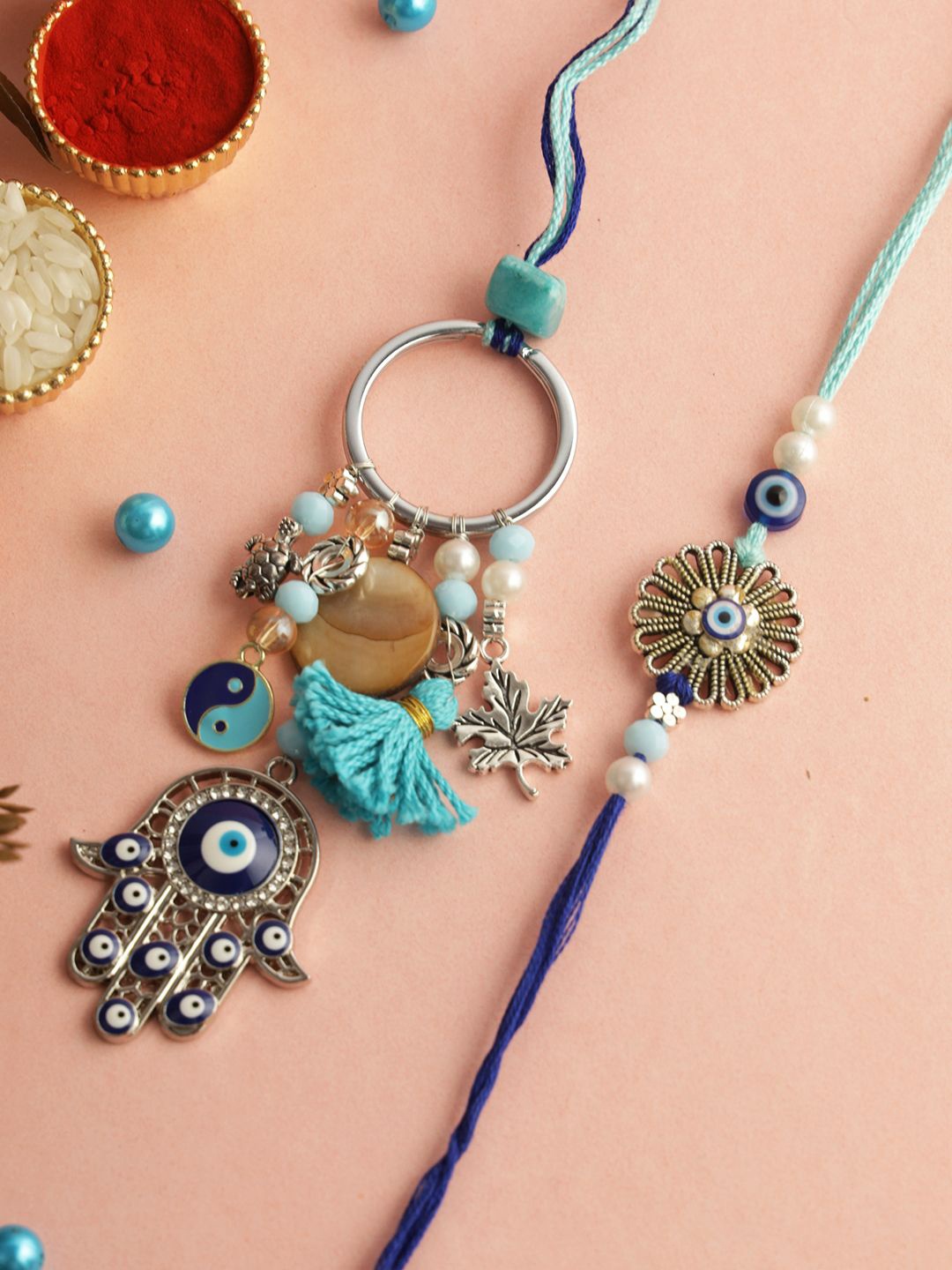 

Sangria Blue Evil Eye Protection Bhaiya Bhabhi Rakhi With Roli Chawal & Greetings Card