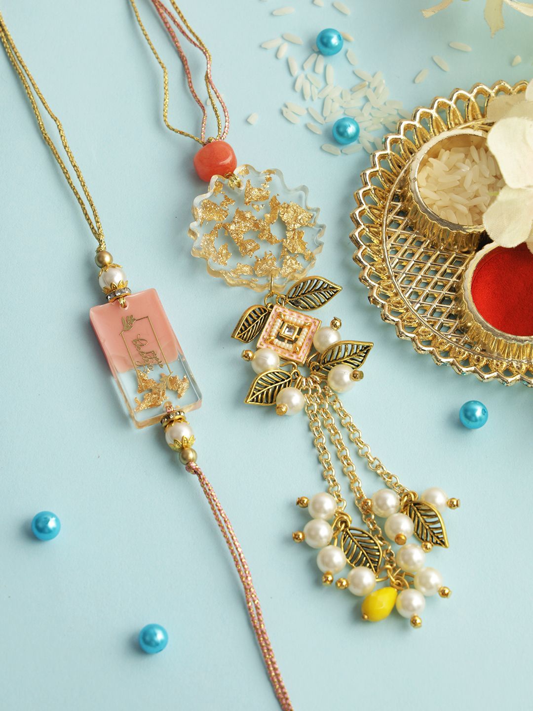

Sangria Gold-Toned Floral Resin Work Thread Bhaiya Bhabhi Rakhi With Roli Chawal & Card