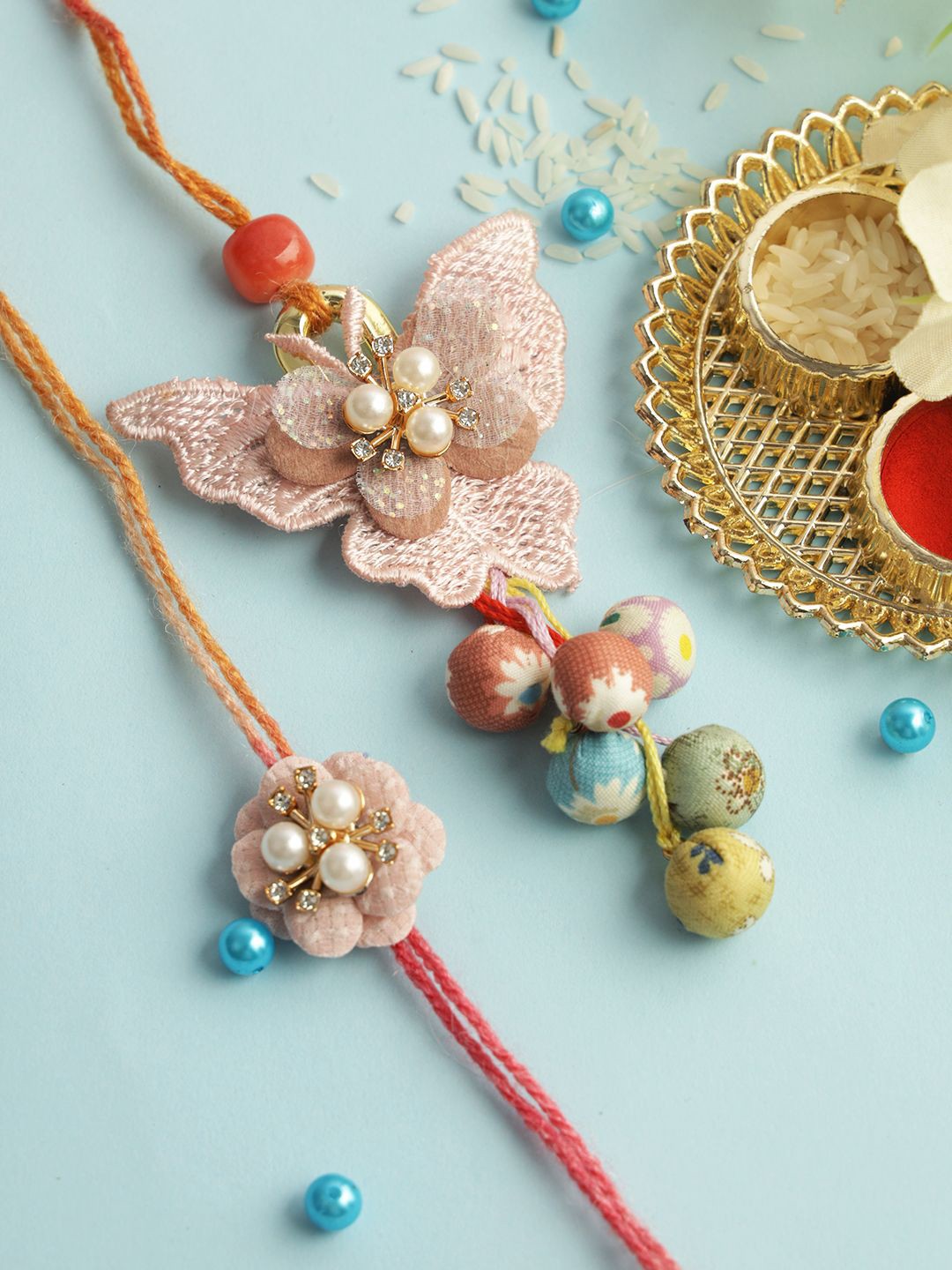 

Sangria Peach-Coloured Butterfly Charm Bhaiya Bhabhi Rakhi With Roli Chawal & Card