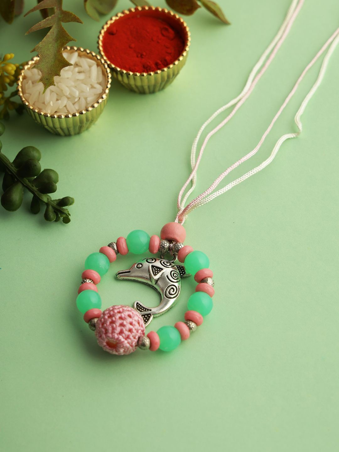 

Kook N Keech Whale Designed Beaded Lumba Rakhi With Roli Chawal & Greetings Card, Pink
