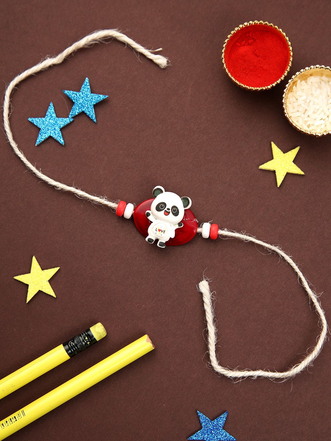 

Kook N Keech White Panda Cartoon Thread Rakhi With Roli Chawal & Greetings Card