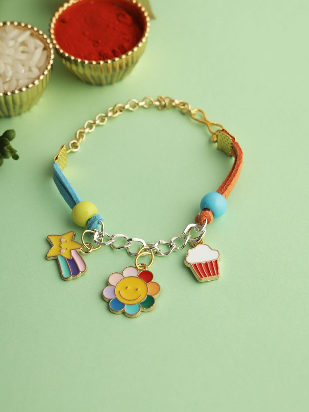 

Kook N Keech Yellow Floral Charm Bracelet Rakhi With Roli Chawal & Greetings Card
