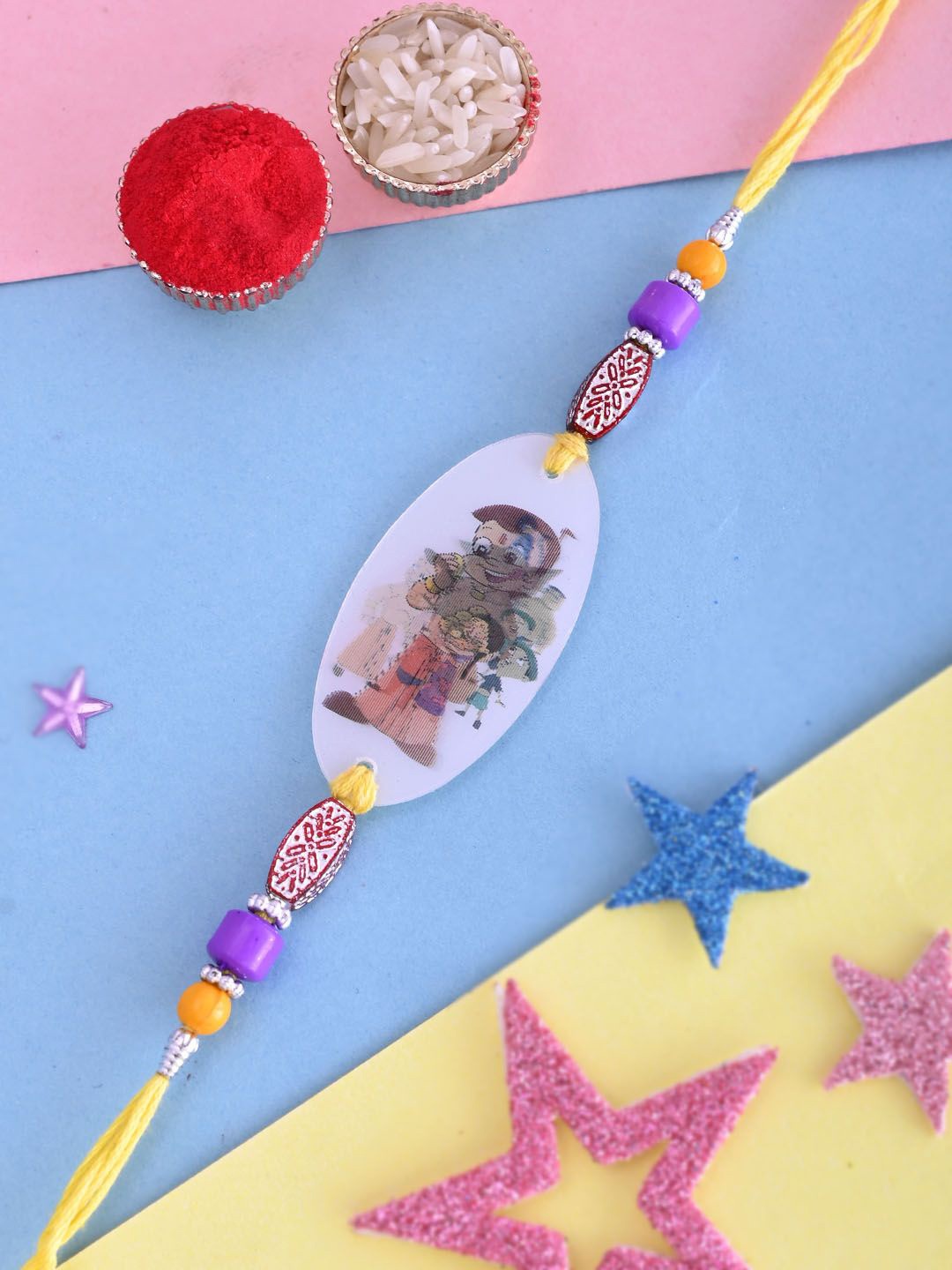 

Kook N Keech Purple Chota Bheem Beaded Thread Rakhi With Roli Chawal & Greetings Card