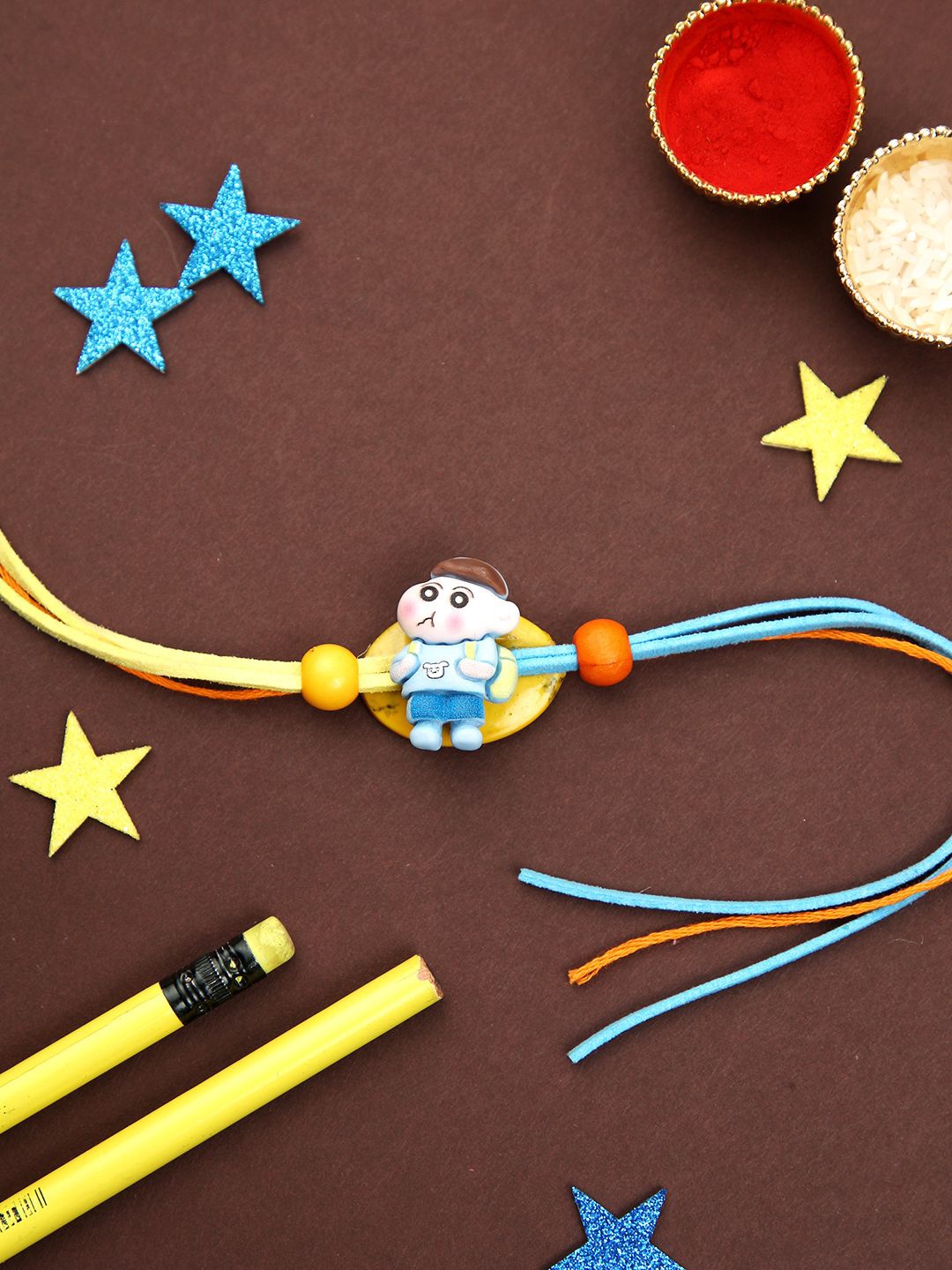 

Kook N Keech Blue Shin Chan Cartoon Thread Rakhi With Roli Chawal & Greetings Card