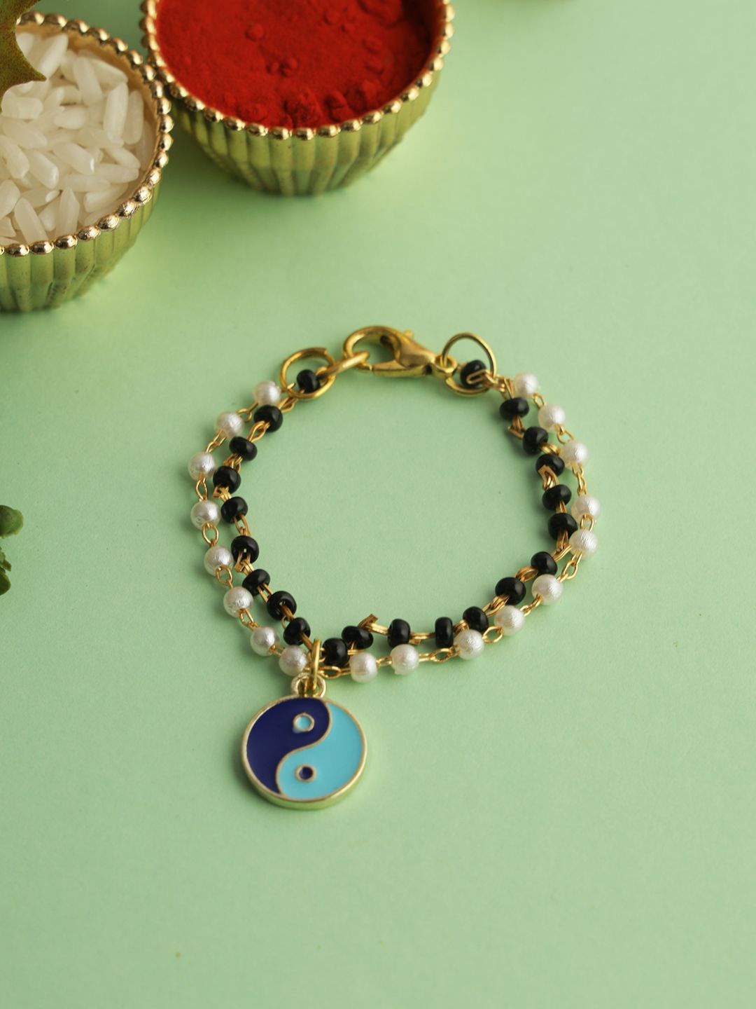 

Kook N Keech Set Of 1 Beaded with Peace Charm Bracelet Rakhi with Roli Chawal, Blue