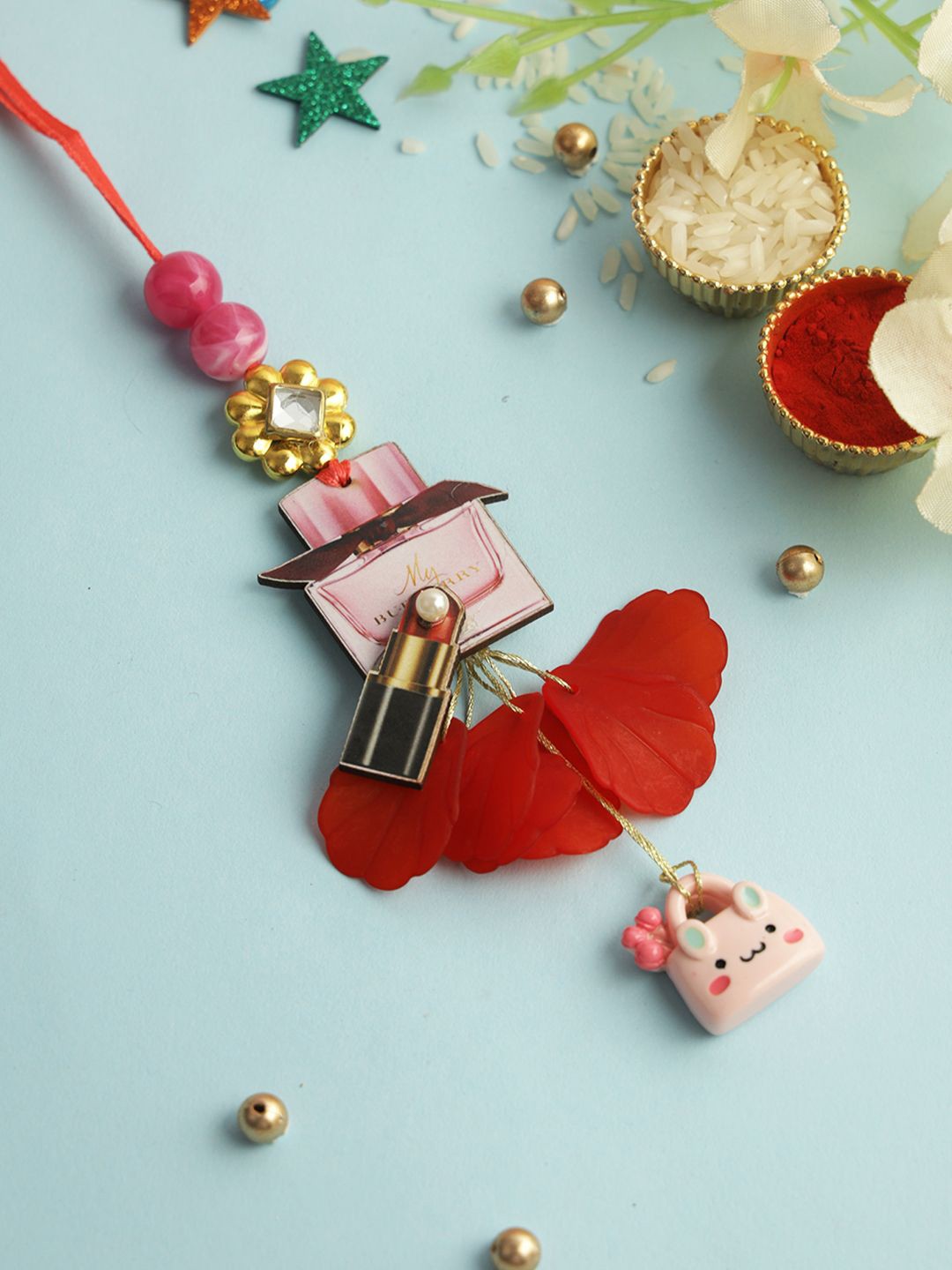 

Kook N Keech Red Beaded Lumba Rakhi with Roli Chawal & Greeting Card