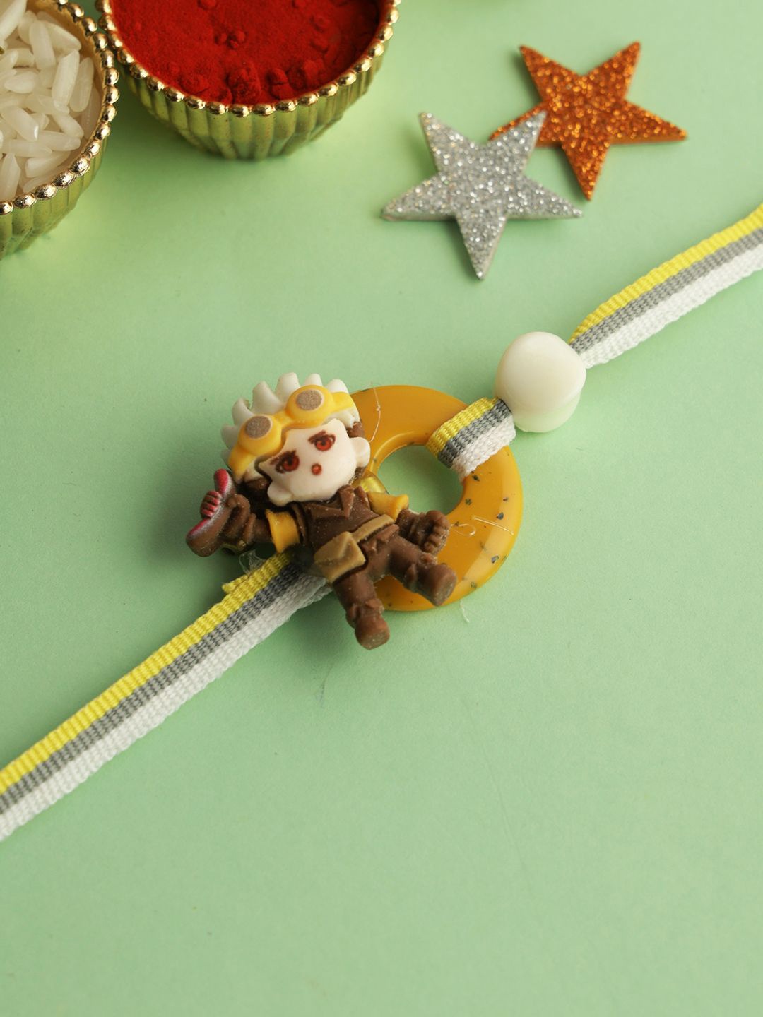 

Kook N Keech Ninja Star Thread Rakhi with Roli Chawal & Greeting Card, Brown