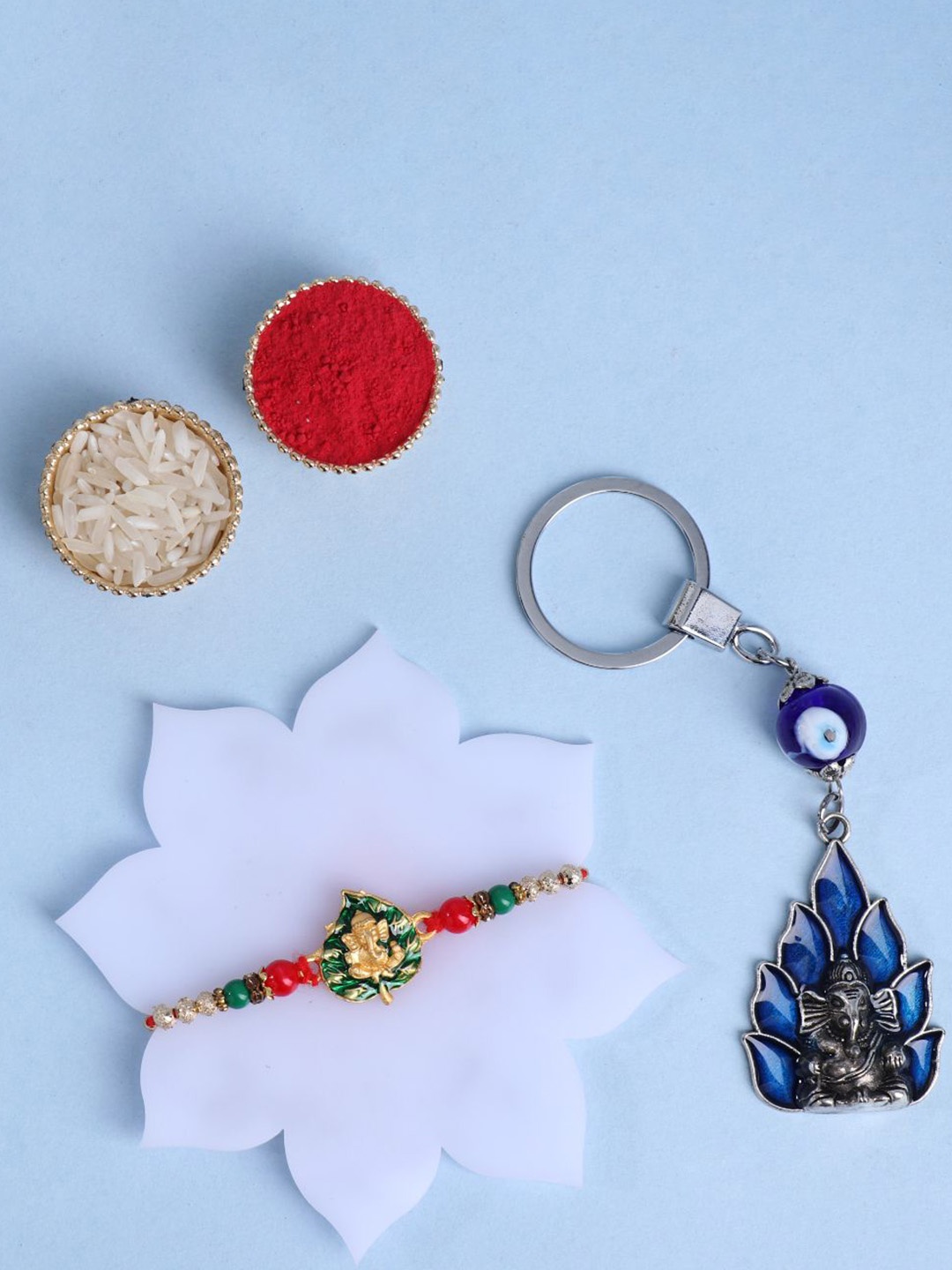 

Floweraura Set Of 2 Beaded Rakhi With Lord Ganesha Key Chain& Roli Chawal, Red