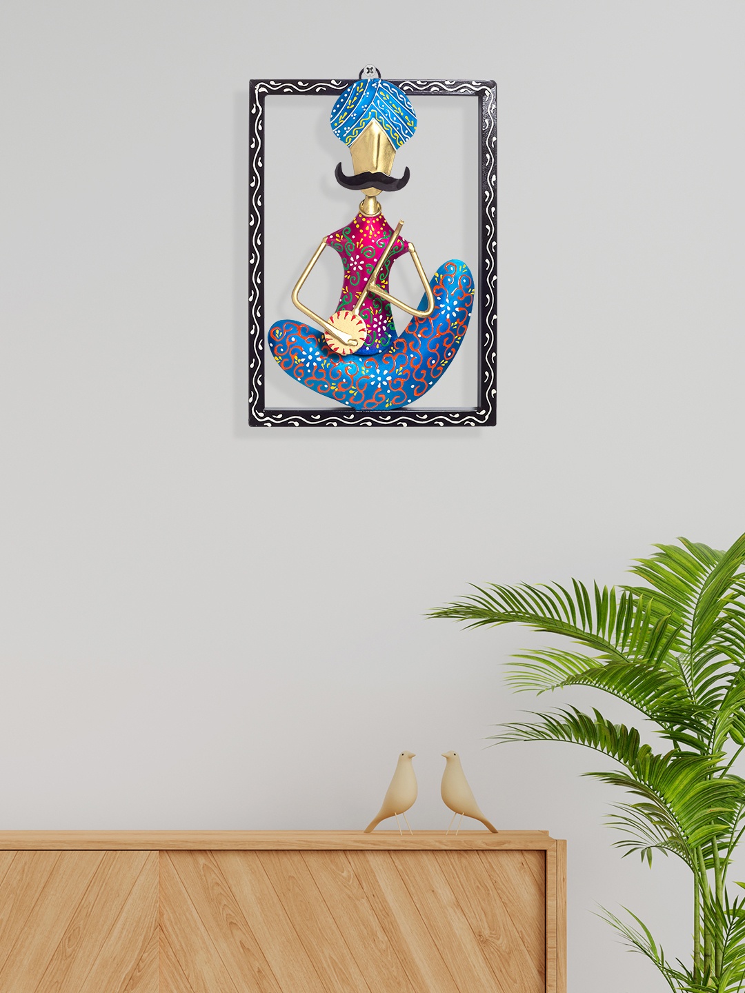 

Golden Peacock Blue & Pink Tribal Metal Musician Wall Decor