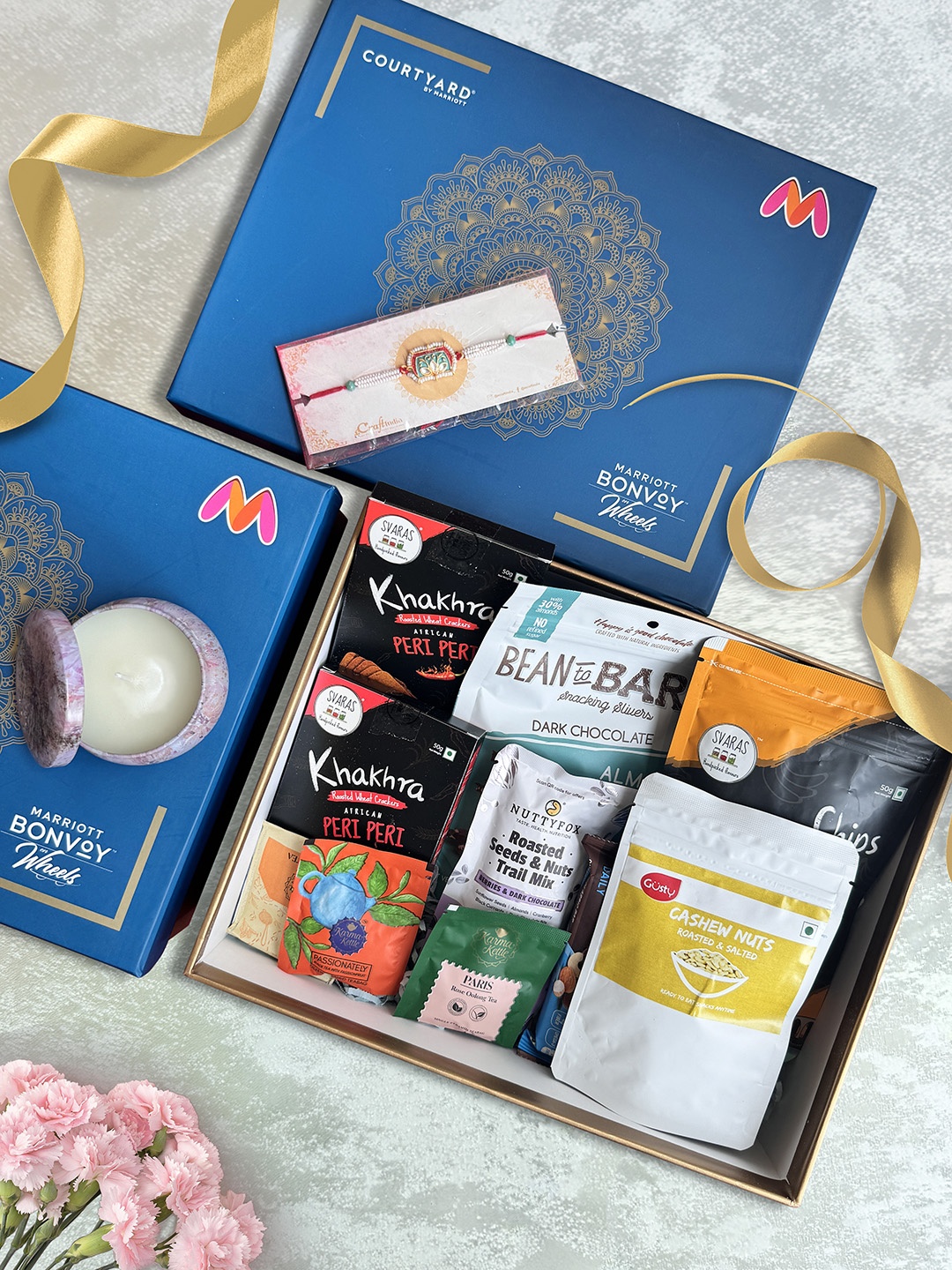 

Courtyard by Marriott - BLR ORR Rakhi with 12Pcs Mixed Assorted Gift Hamper, Blue