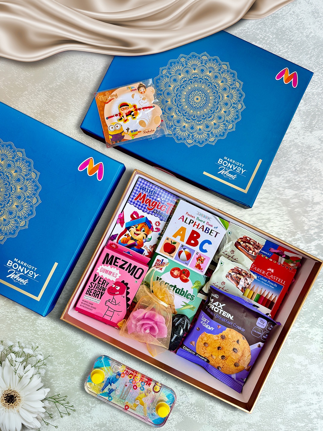 

Courtyard by Marriott - BLR ORR 7Pcs Rakhi With Assorted Gift Hamper, Blue