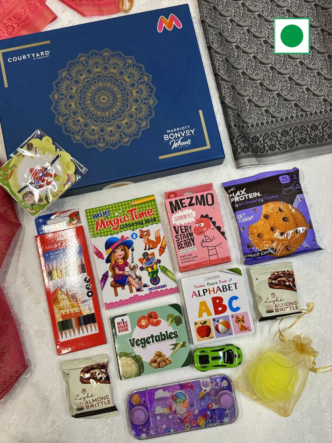 

Courtyard by Marriott - BLR ORR 12Pcs Rakhi With Enhanced Collection Gift Hamper, Blue