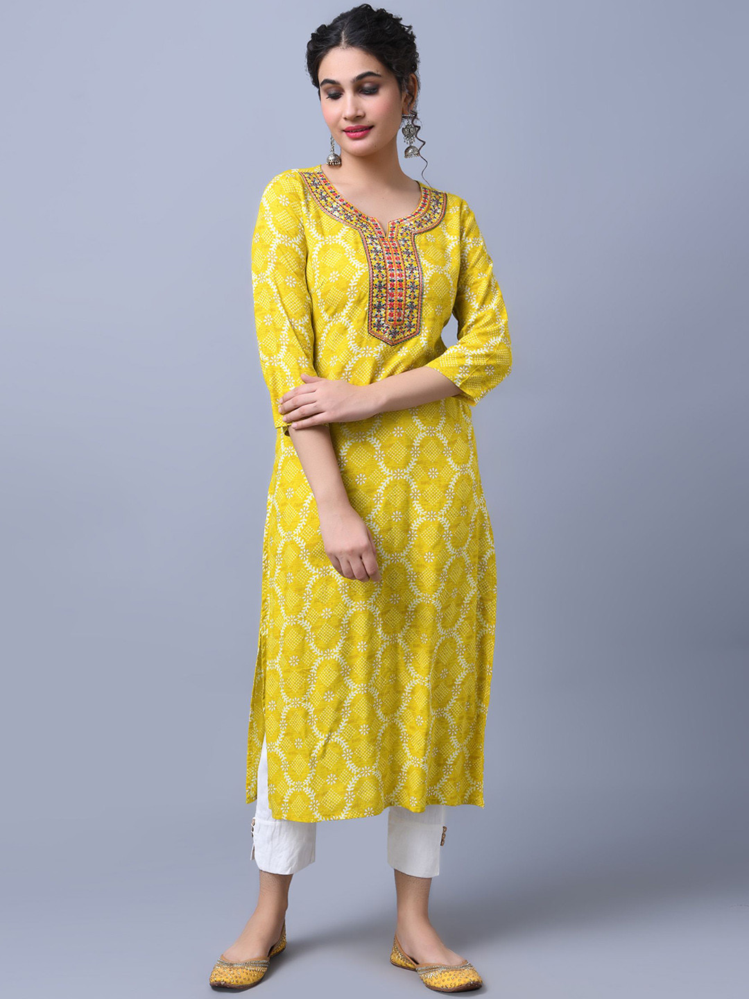 

Anouk Yellow Floral Printed Notch Neck Thread Work Straight Kurta