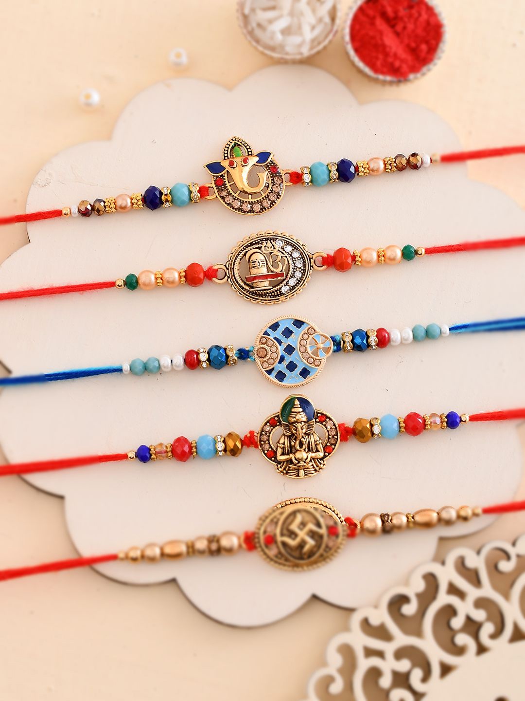 

Anouk Set Of 5 Divine Beaded Thread Rakhi With Roli Chawal & Greetings Card, Gold