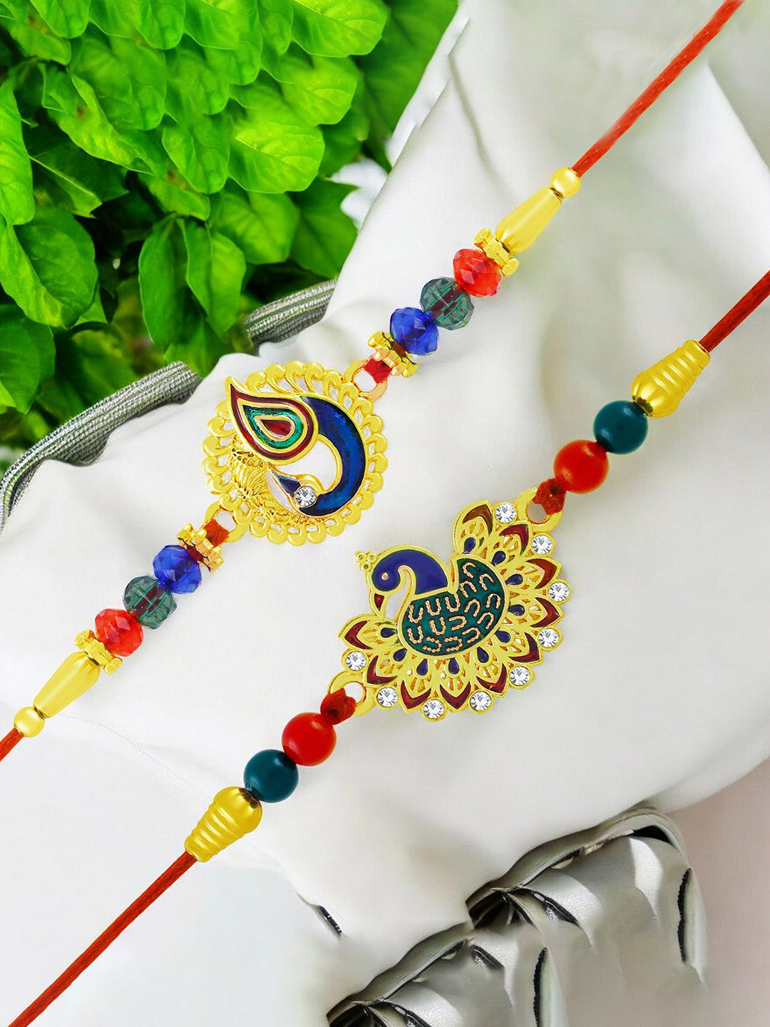 

Okos Set of 2 Gold Plated Dazzling Meenakari Peacock Thread Rakhis
