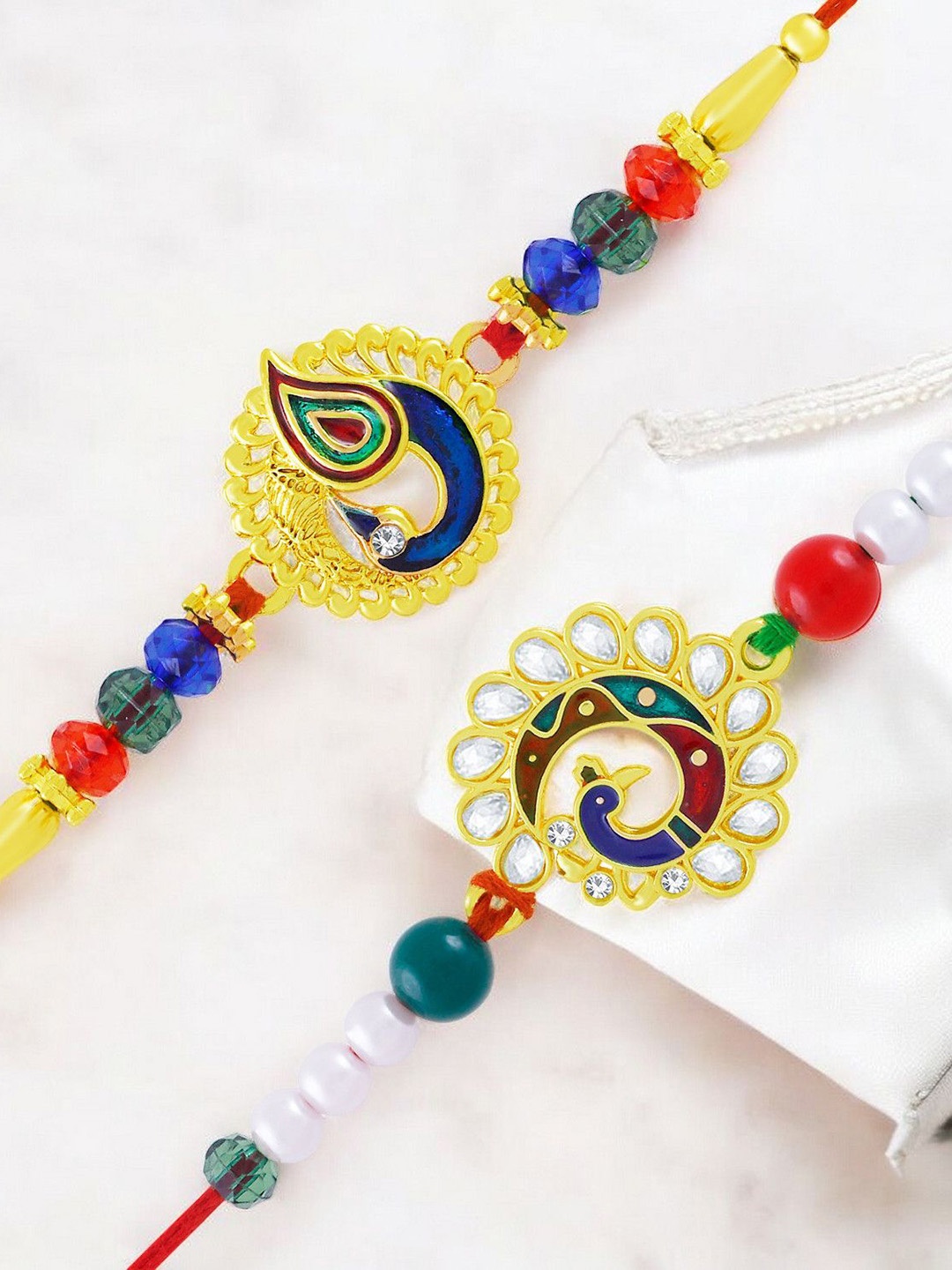 

Okos Set of 2 Gold Plated Dancing Peacock Thread Rakhis