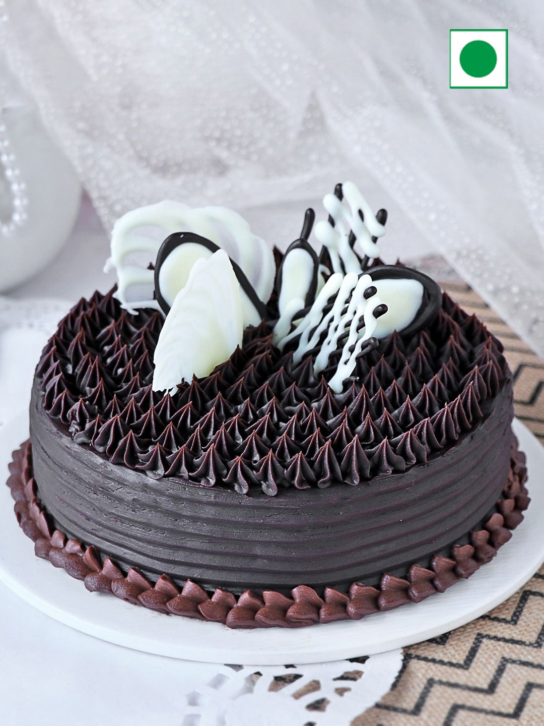 

IGP Chocolate Flavour Eggless Round Cake - 1 Kg, Brown