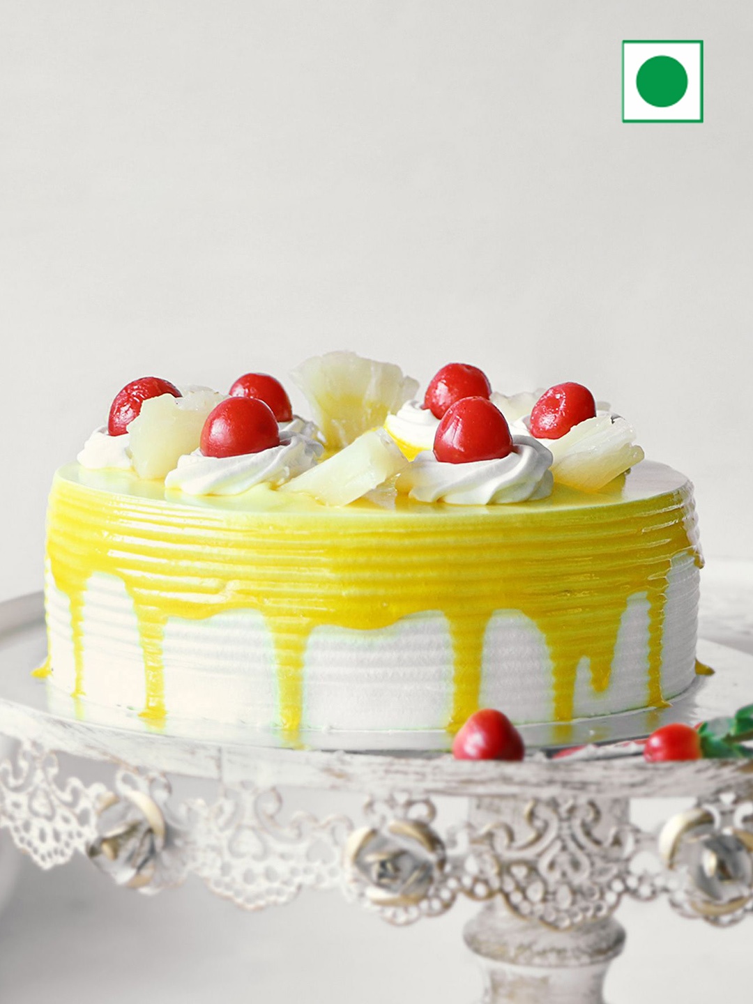 

IGP Pineapple With Cherry Toppings Flavour Eggless Round Cake - 1kg, Yellow