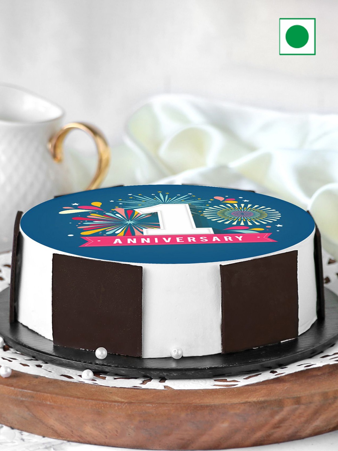 

IGP Black Forest Eggless First Anniversary Round Cake-1kg, Blue