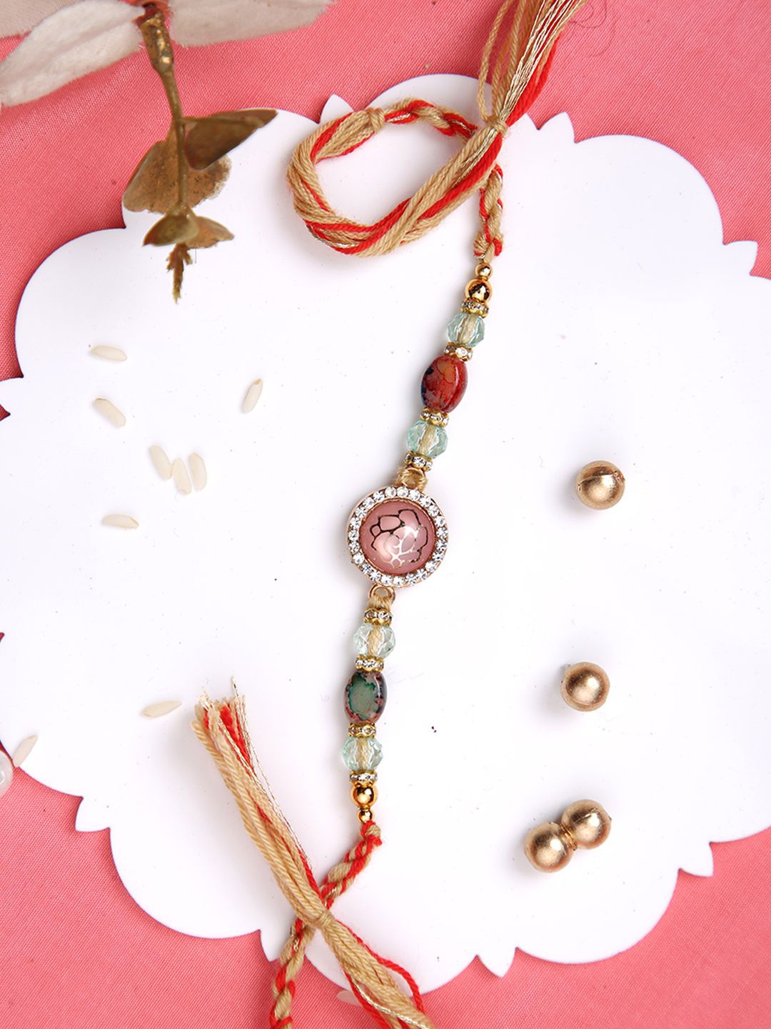 

Aapno Rajasthan Beaded Rakhi With Roli Chawal & Greeting Card, Peach