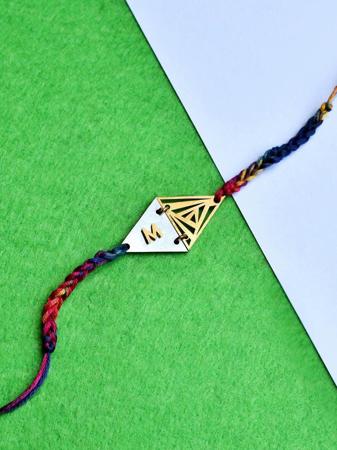 

BeAbhika P Initial Two Triangle Rakhi With Roli & Chawal, Red
