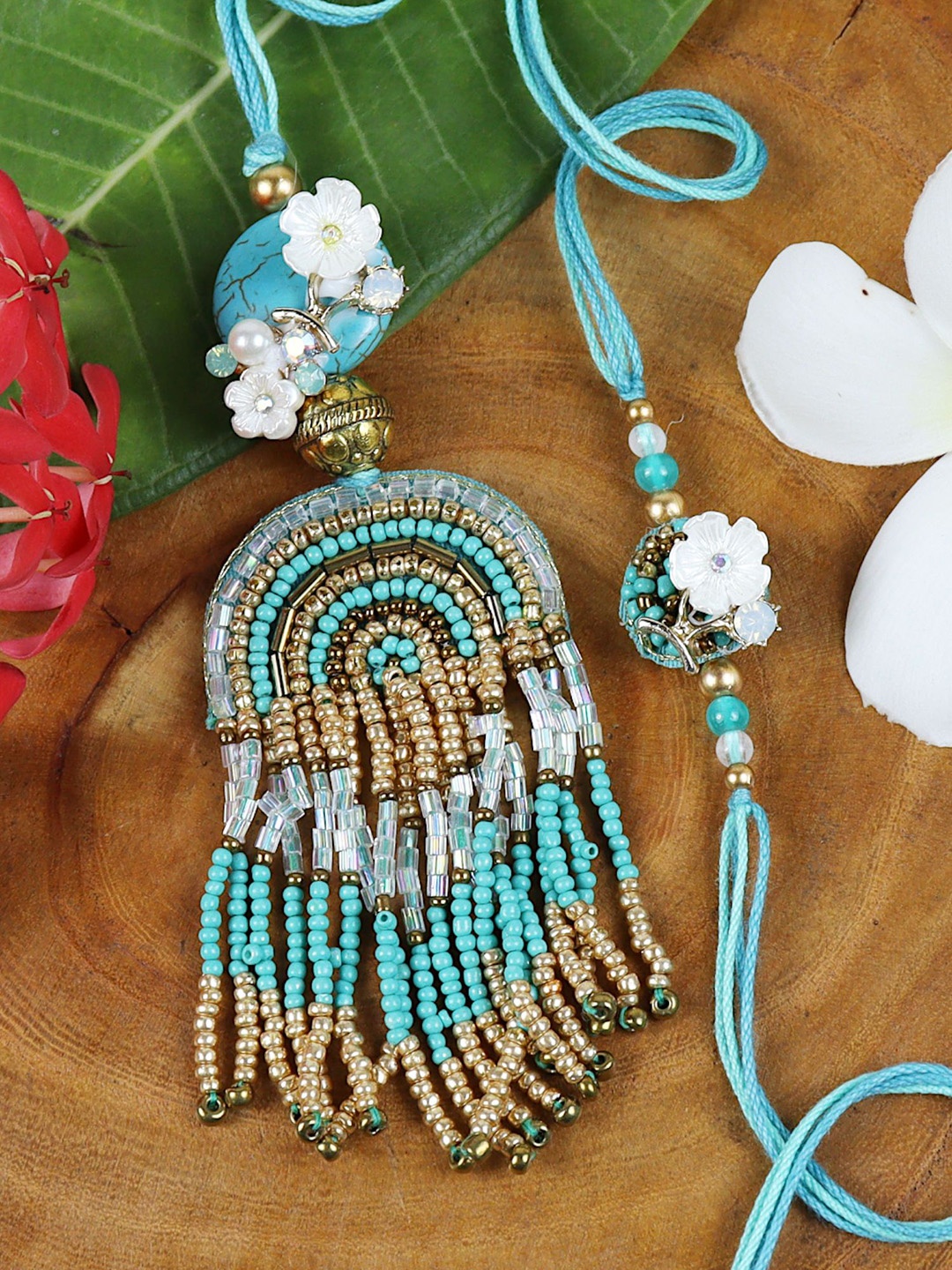 

Asthetika Beaded Tassels Floral Charms Bhaiya Bhabhi Rakhi Pair with Roli Chawal, Blue