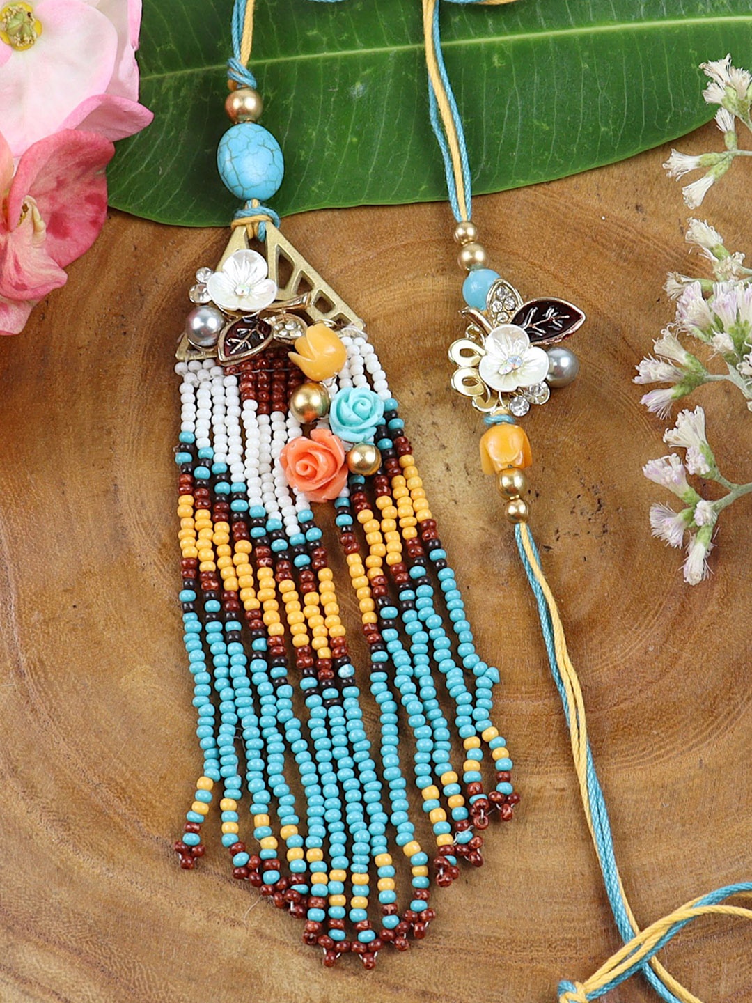 

Asthetika Beaded Tassels Floral Charms Bhaiya Bhabhi Rakhi with Roli Chawal, Blue
