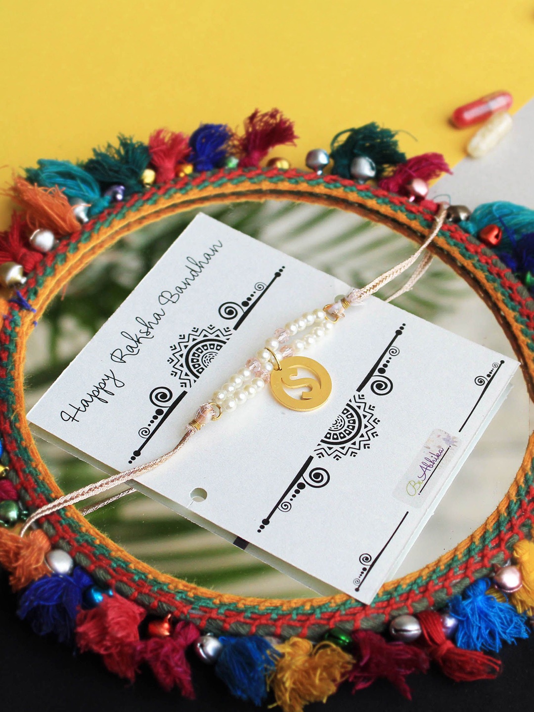 

BeAbhika U Beaded Intial Rakhi With Roli & Chawal Capsules, White