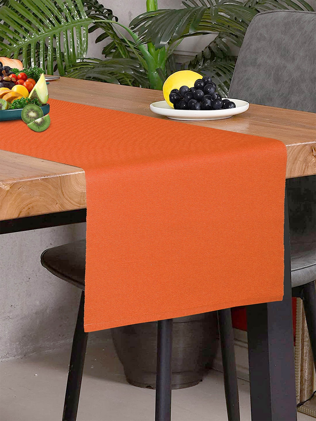 

HOME COLORS.IN Orange Self designed Cotton Table Runner