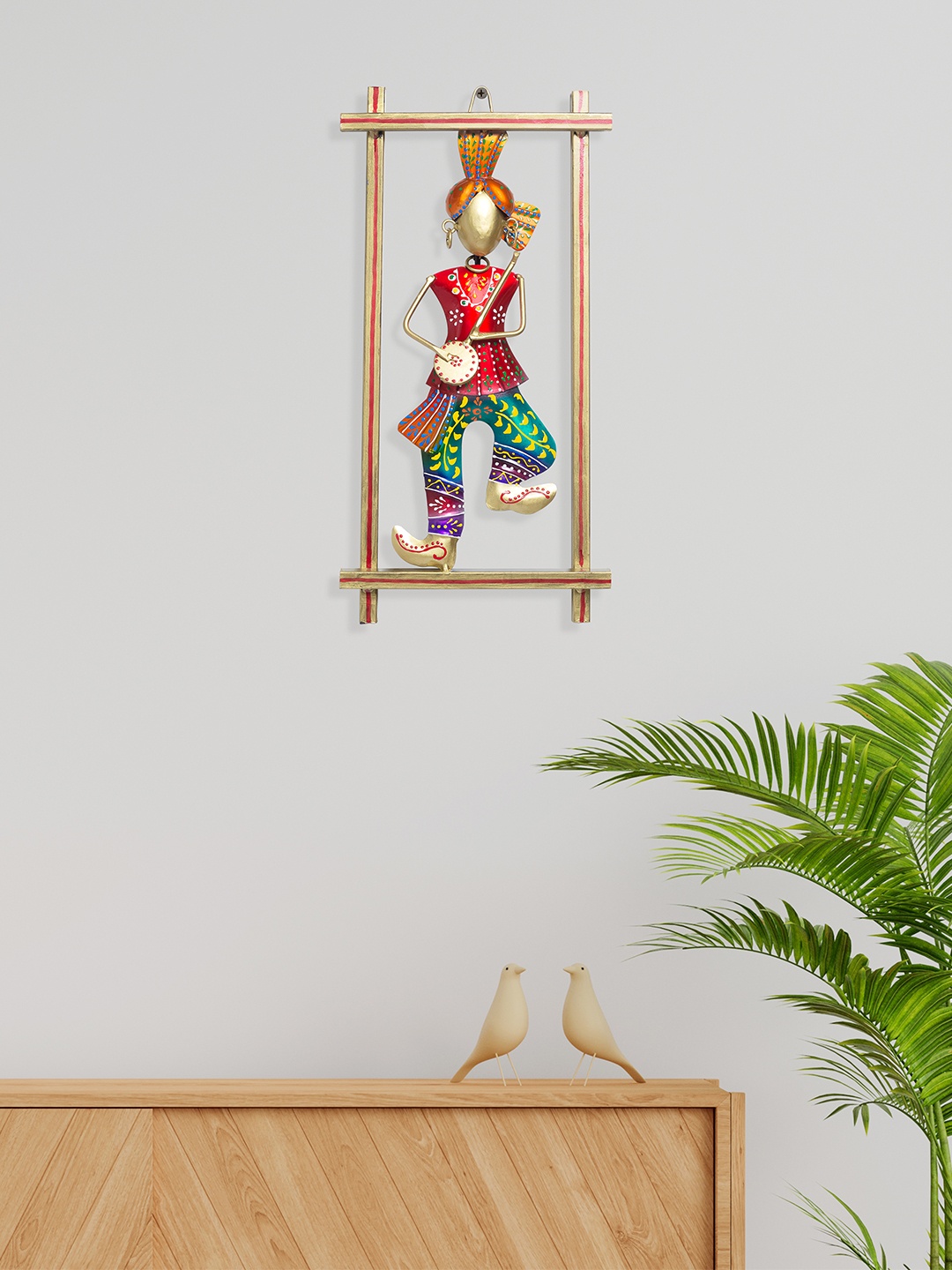 

Golden Peacock Red & Blue Textured Rajasthani Musician Metal Wall Hangings