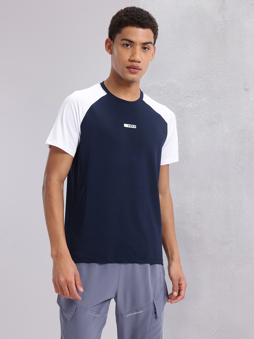 

HRX by Hrithik Roshan Colourblocked Raglan Sleeve Running T-shirt with Brand Logo Detail, Blue