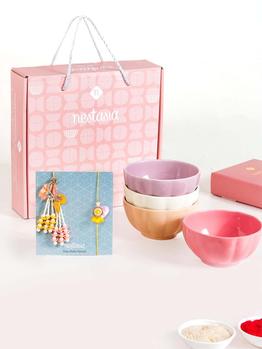 

Nestasia Bhaiya Bhabhi Rakhi With Ceremic Bowls & Roli Chawal, Pink