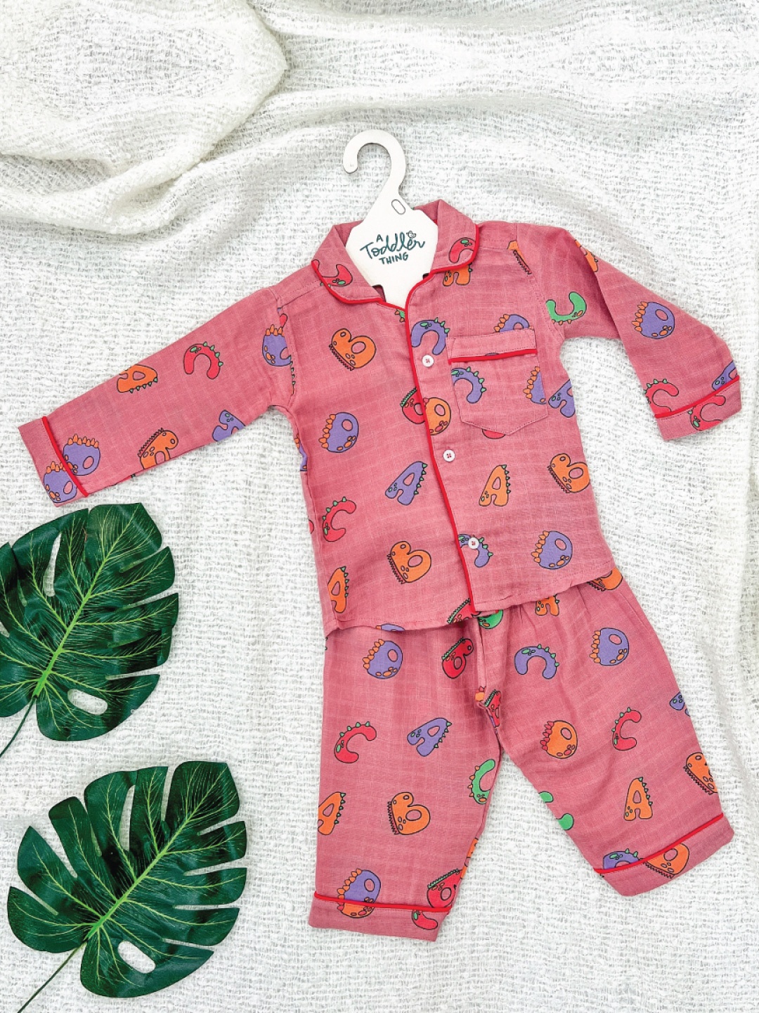 

A Toddler Thing Alpha Dino Unisex Kids Printed Night suit, Pink
