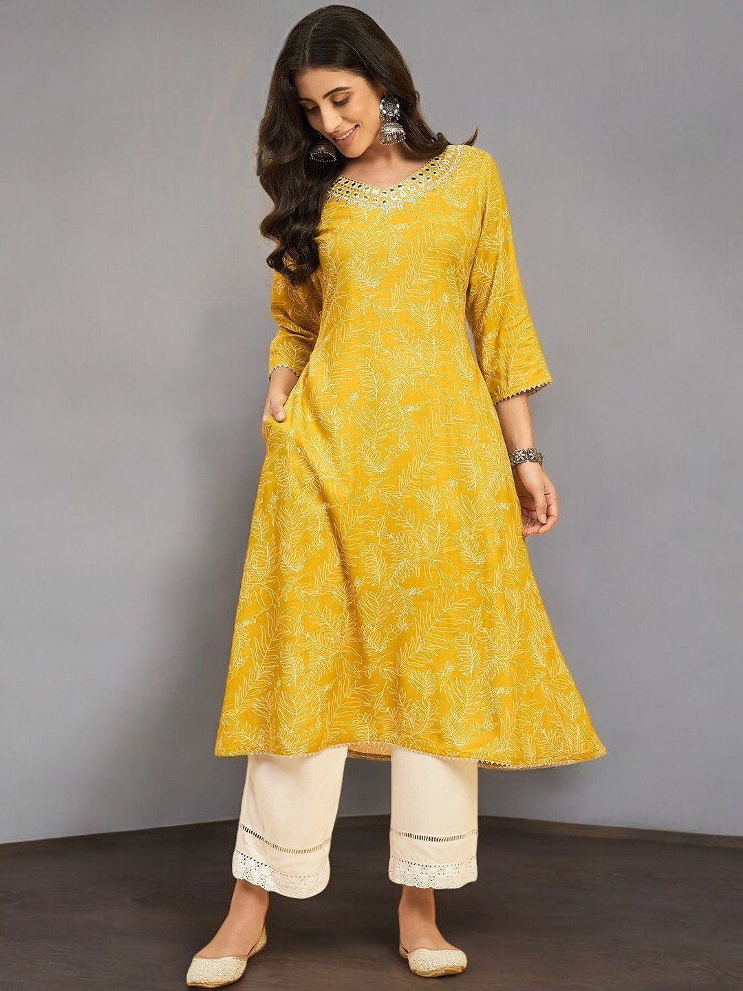 

Azira Floral Printed V-Neck Mirror Work A-Line Kurta, Yellow