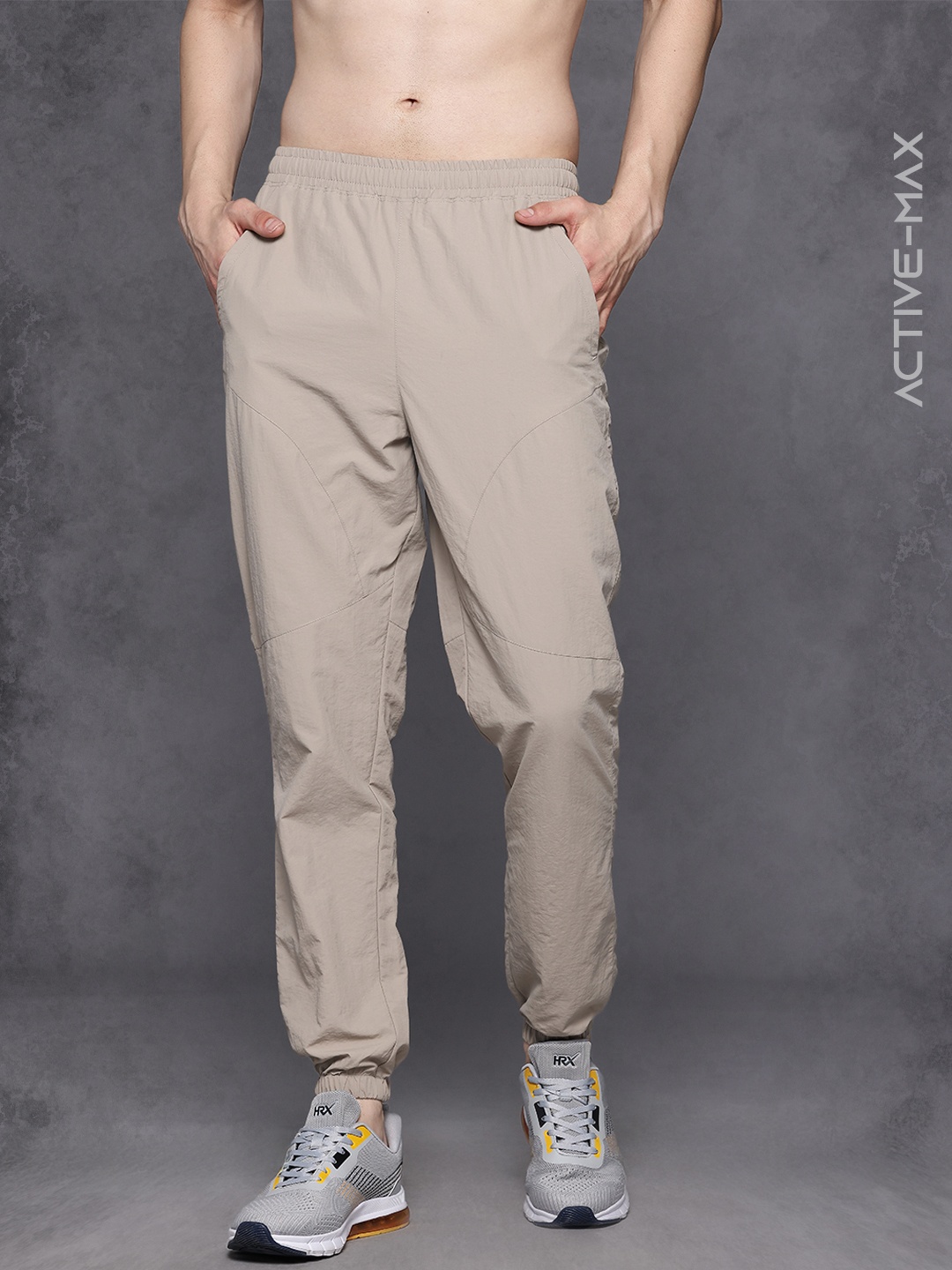 

HRX by Hrithik Roshan Men Brand Logo Detail Regular Fit Rapid-Dry Training Joggers, Beige
