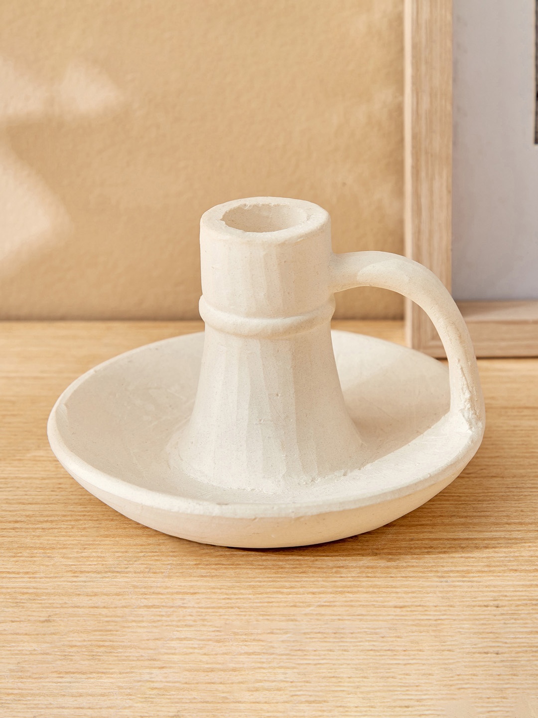 

Home Centre Off White Ceramic Candle Holder