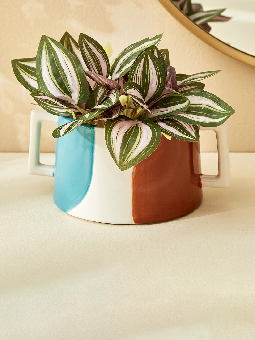 

Home Centre Splendid Townsquare Xena Blue & Brown Colorblocked Ceramic Textured Planter