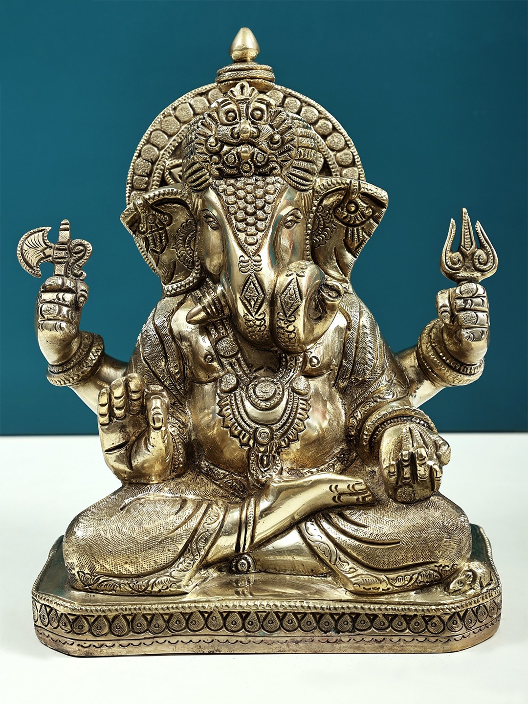 

Exotic India Gold-Toned Ganesha Brass Religious Idol Showpiece