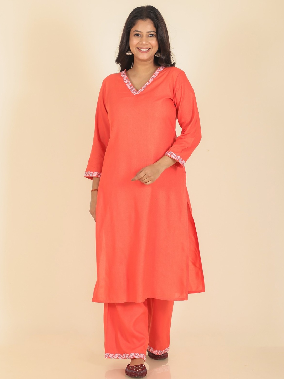

Aramya V Neck Thread Work Straight Kurta With Palazzos, Orange