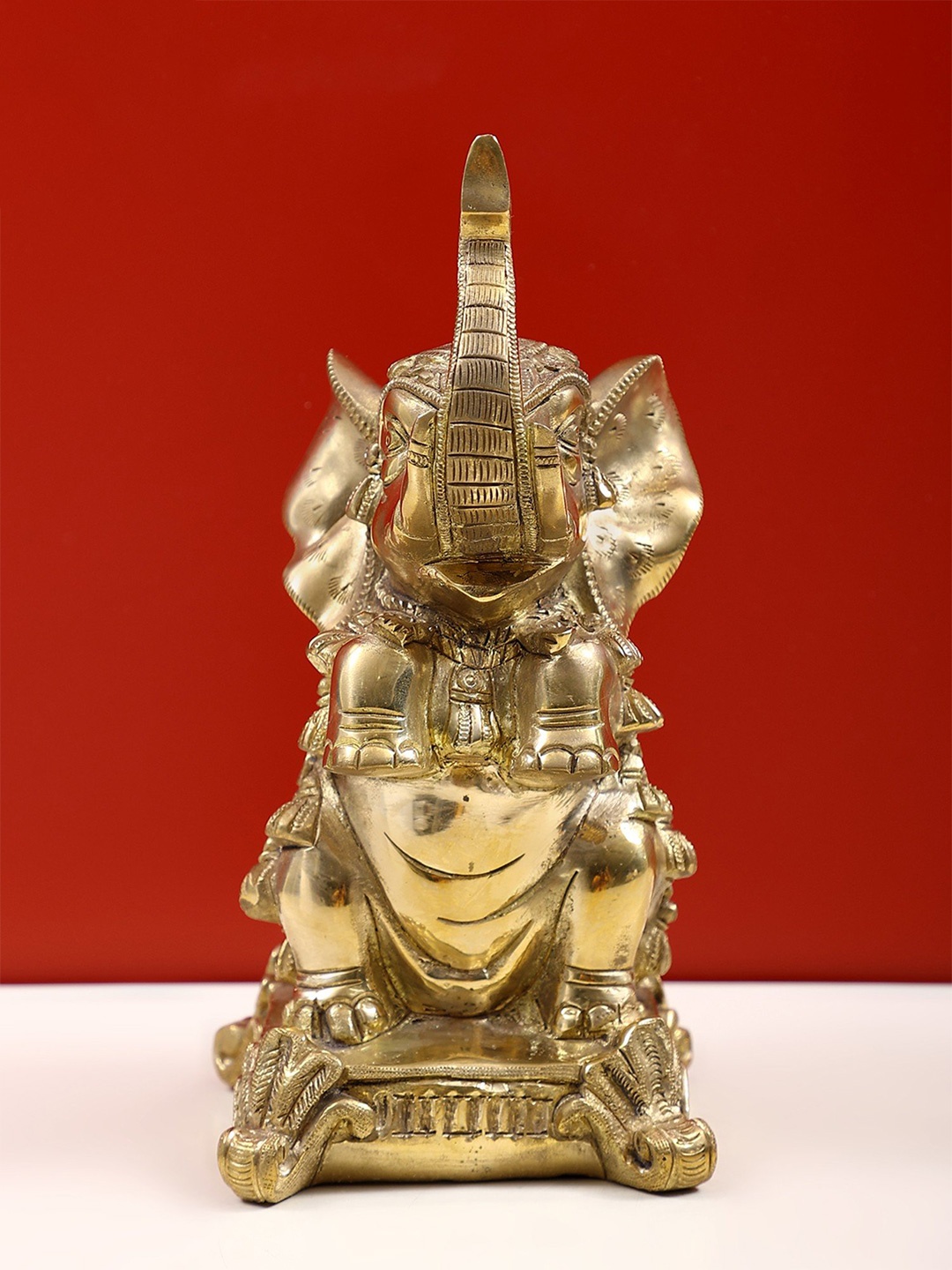 

Exotic India Gold-Toned Brass Religious Figurine Showpiece